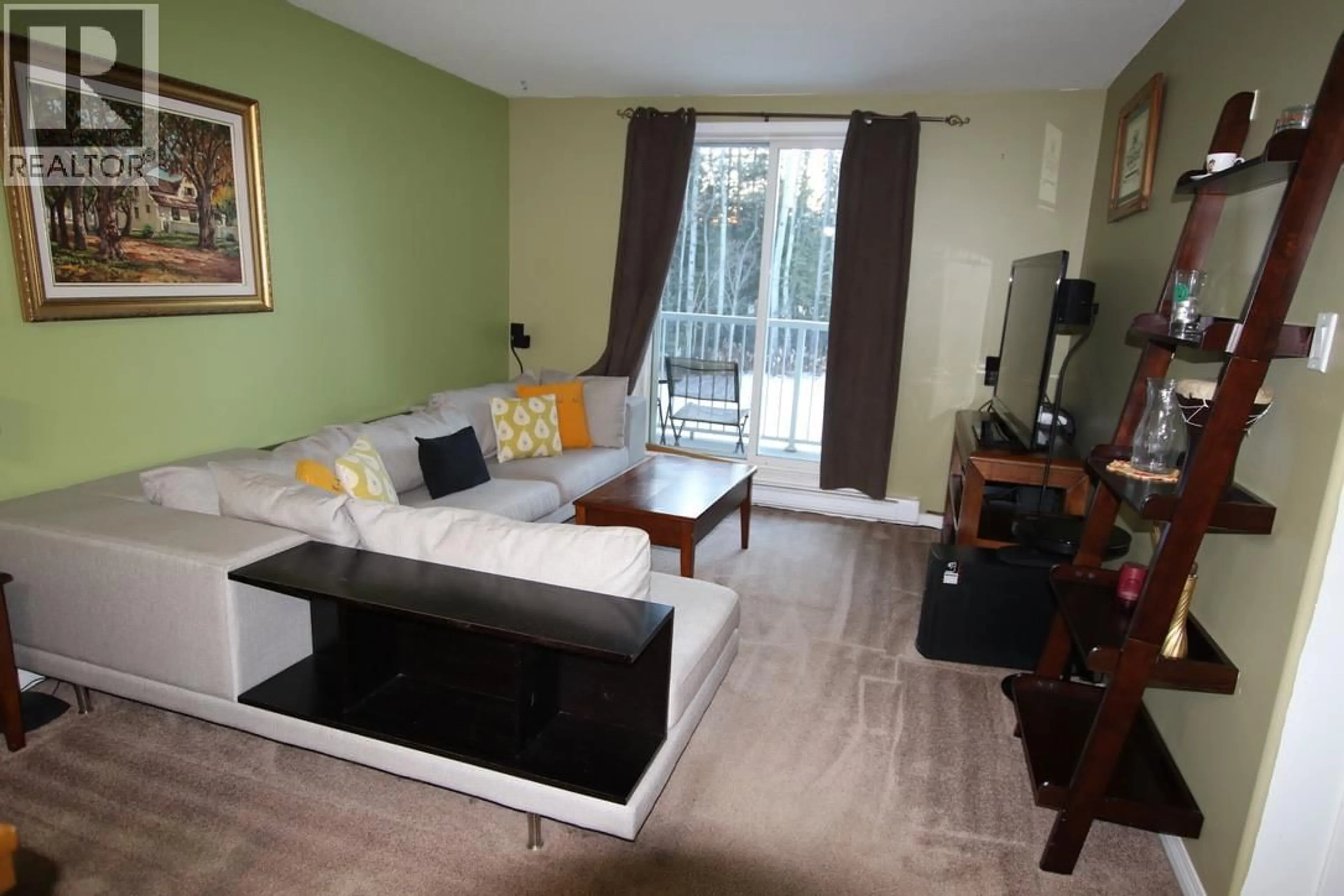 Living room with furniture, wood/laminate floor for 212 - 212 SPIEKER AVENUE, Tumbler Ridge British Columbia V0C2W0