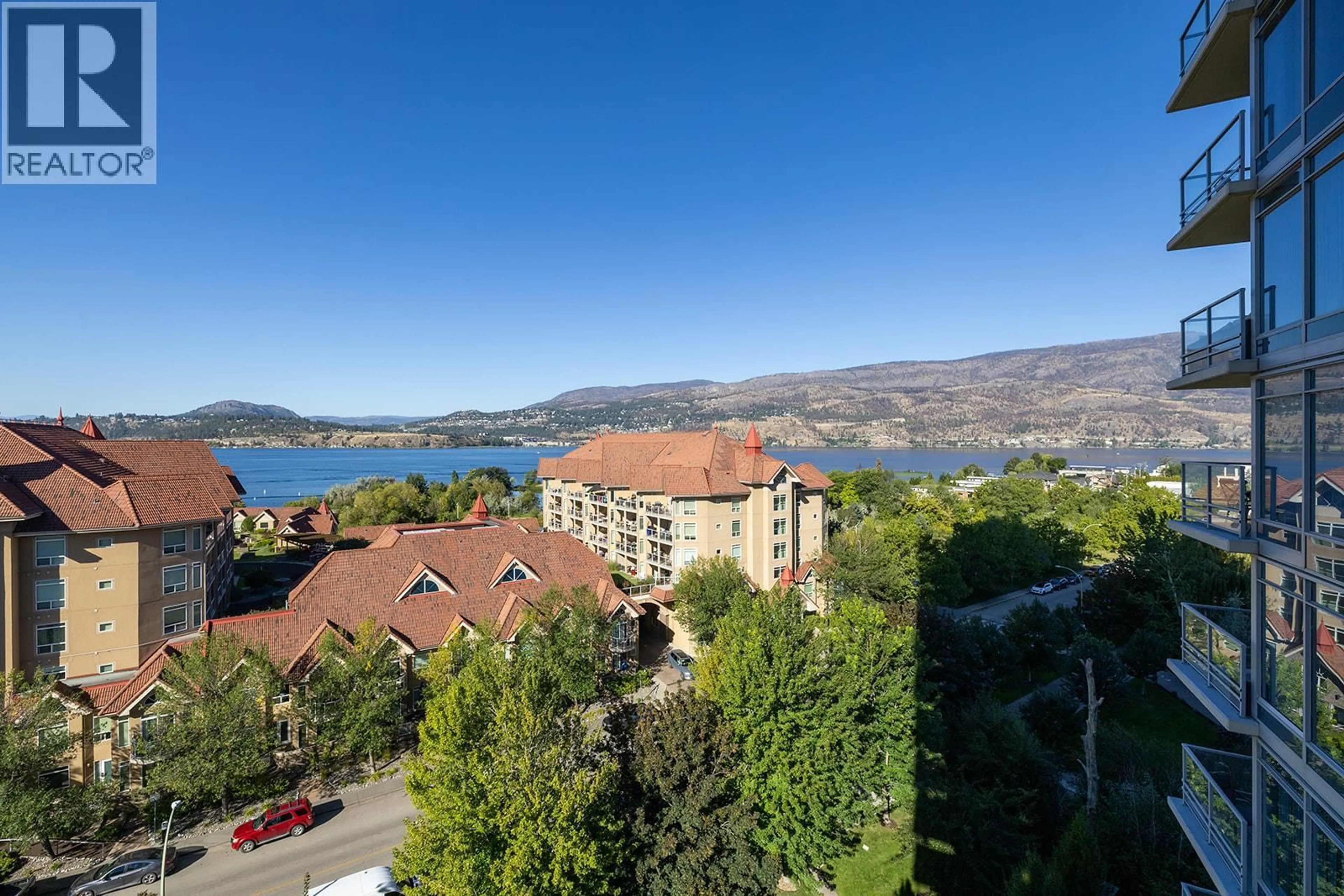 A pic from outside/outdoor area/front of a property/back of a property/a pic from drone, water/lake/river/ocean view for 906 - 1075 SUNSET DRIVE, Kelowna British Columbia V1Y9Y9