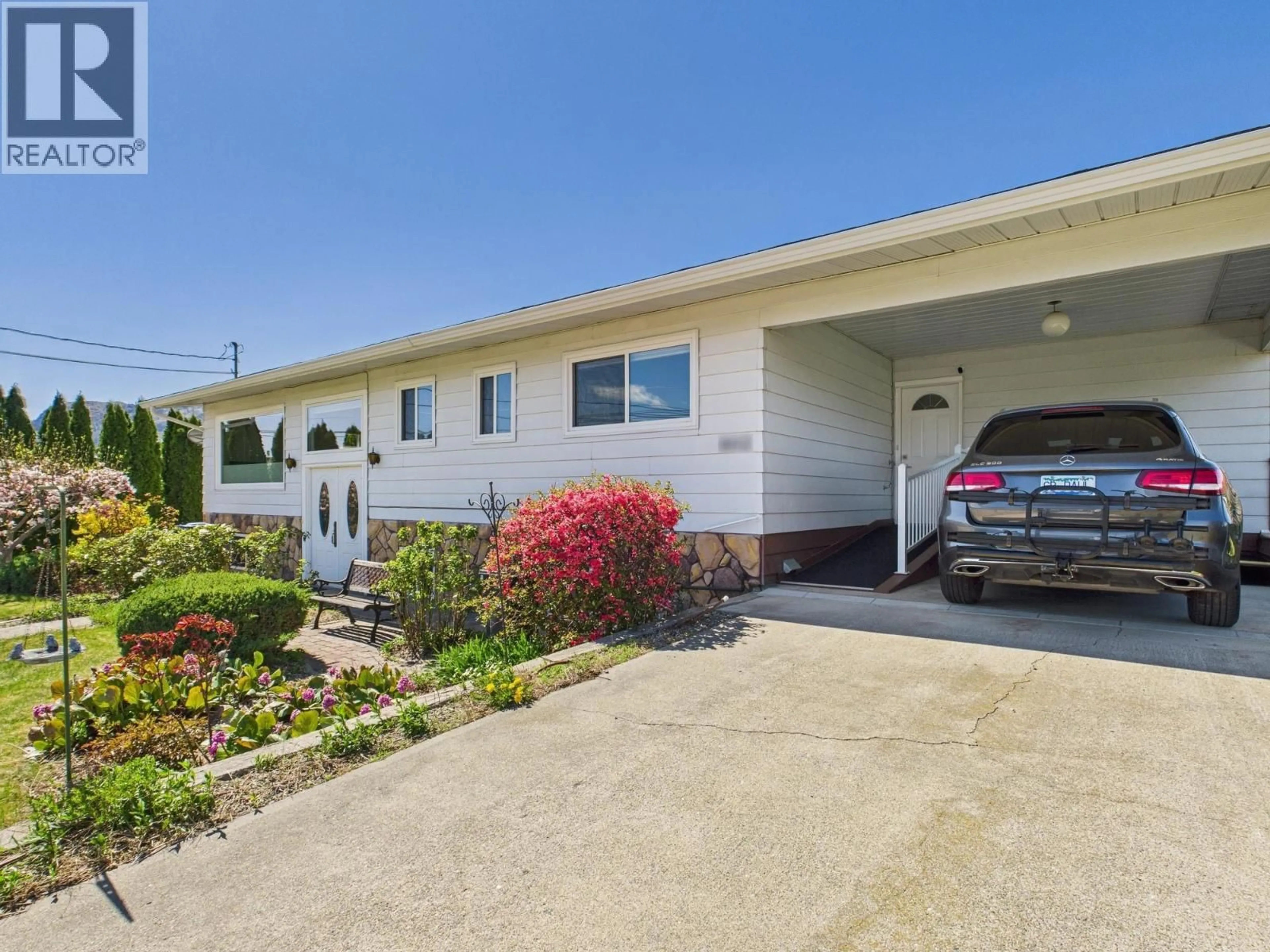 Home with vinyl exterior material, street for 6012 107TH STREET, Osoyoos British Columbia V0H1V2