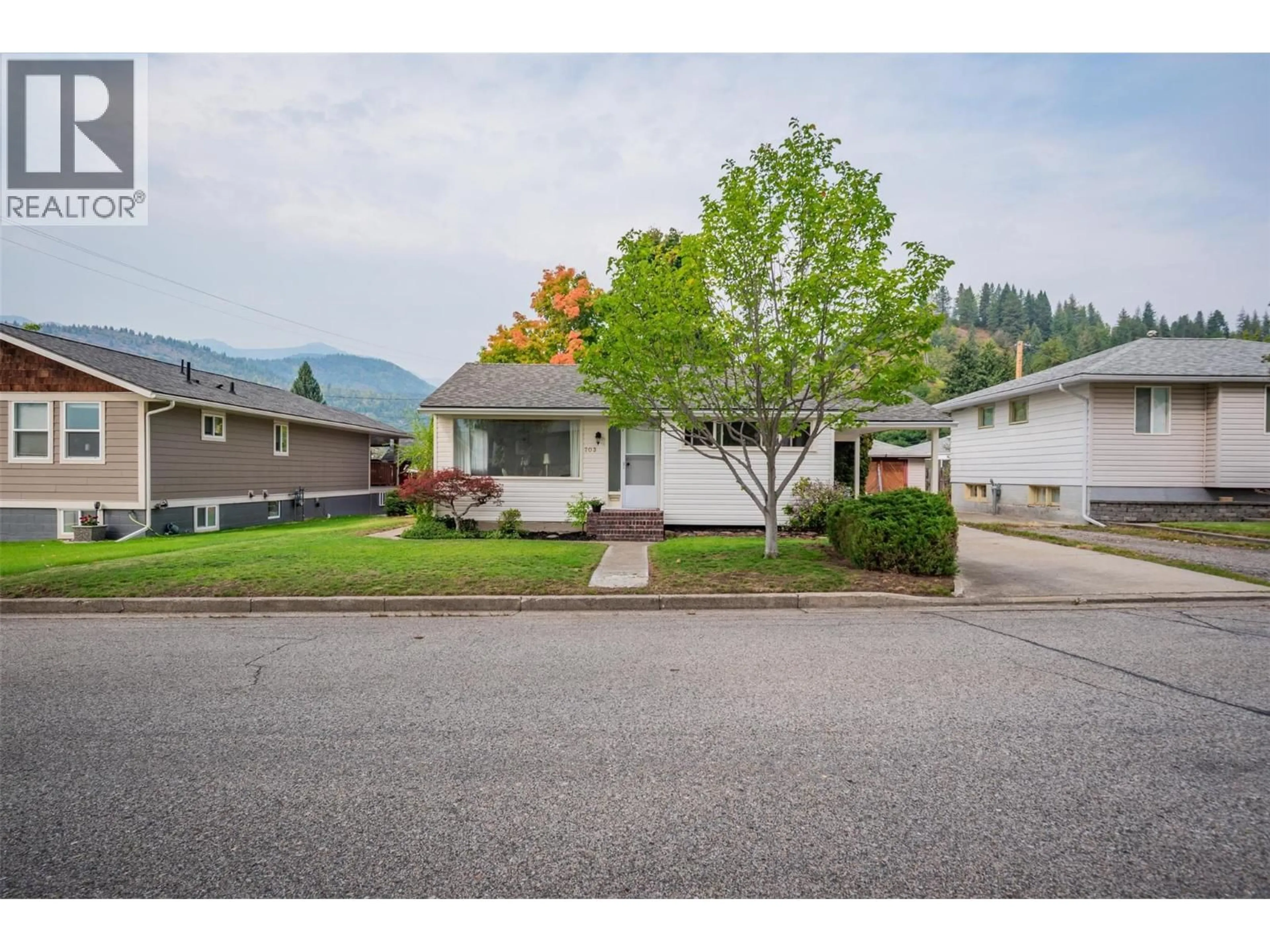 Home with vinyl exterior material, mountain view for 703 HERMIA CRESCENT, Trail British Columbia V1R1B3