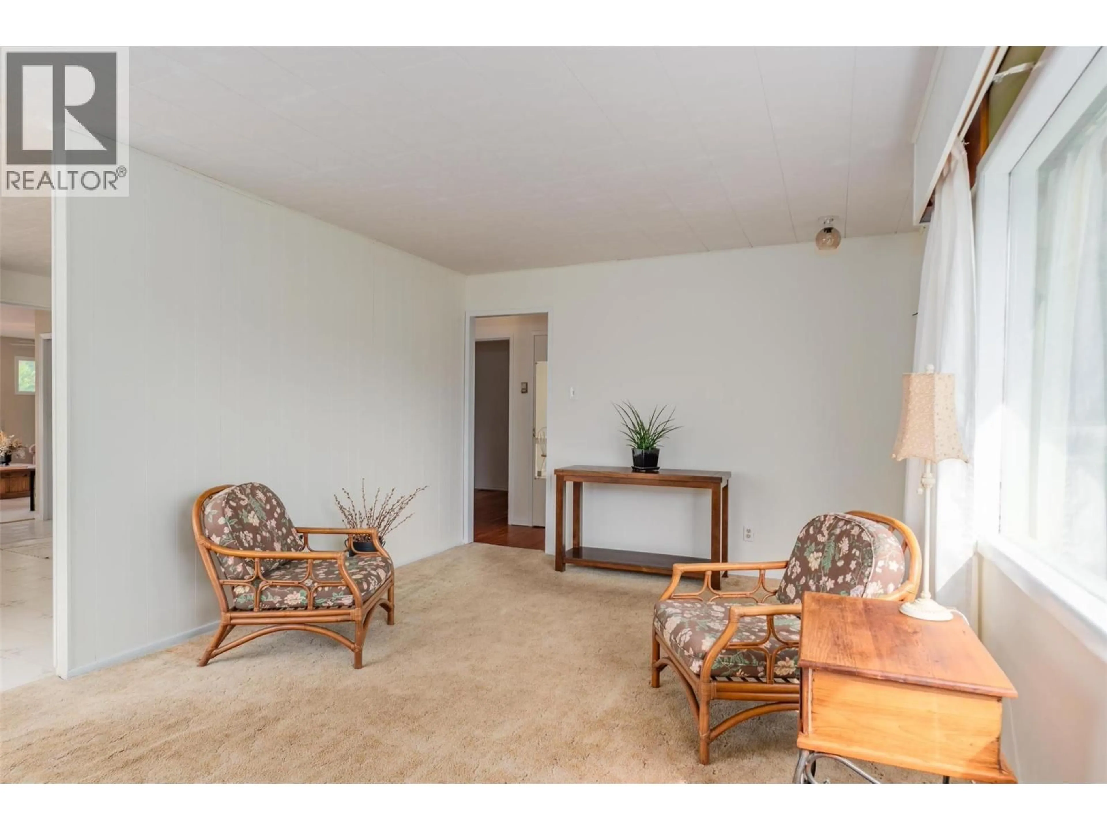 Living room with furniture, unknown for 703 HERMIA CRESCENT, Trail British Columbia V1R1B3