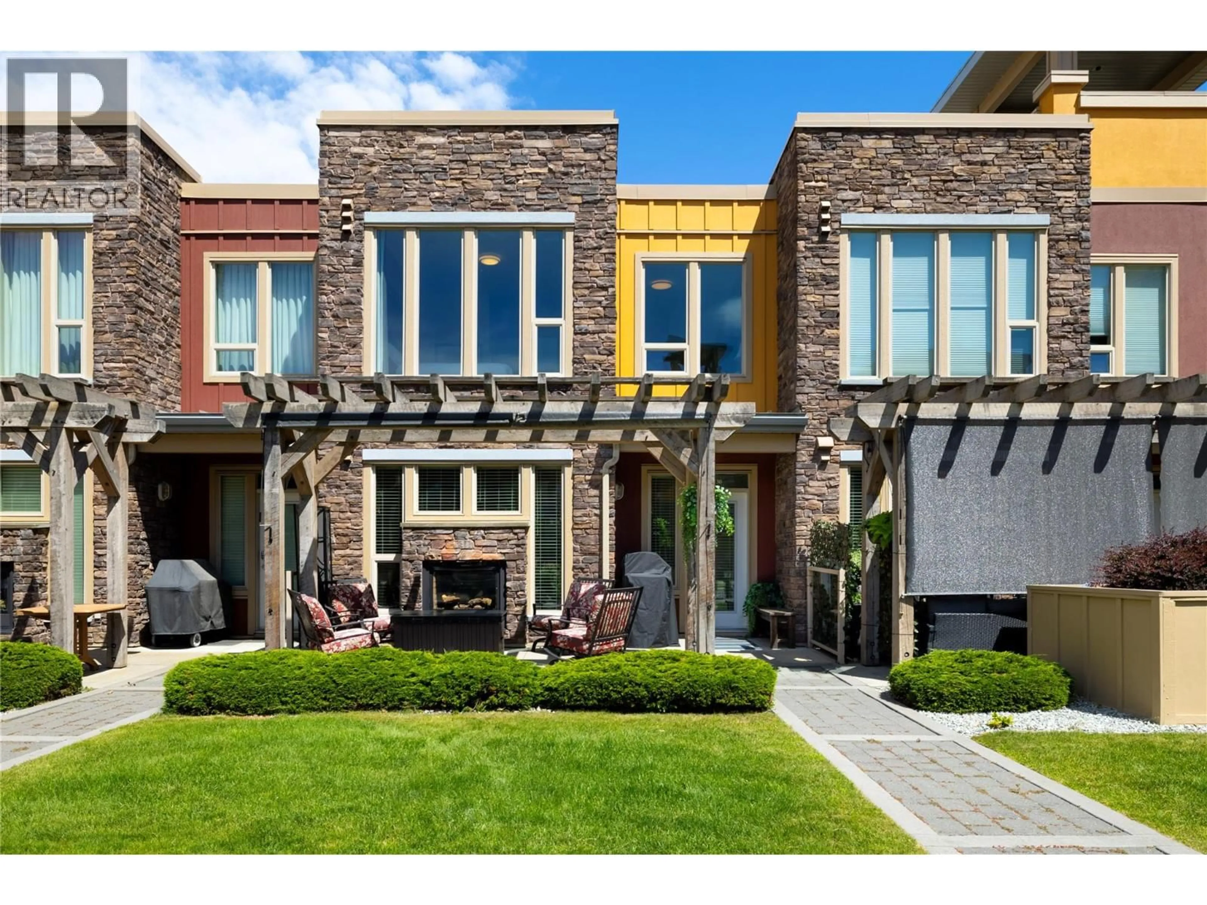 Home with brick exterior material, street for 1130 - 7343 OKANAGAN LANDING ROAD, Vernon British Columbia V1H2J6