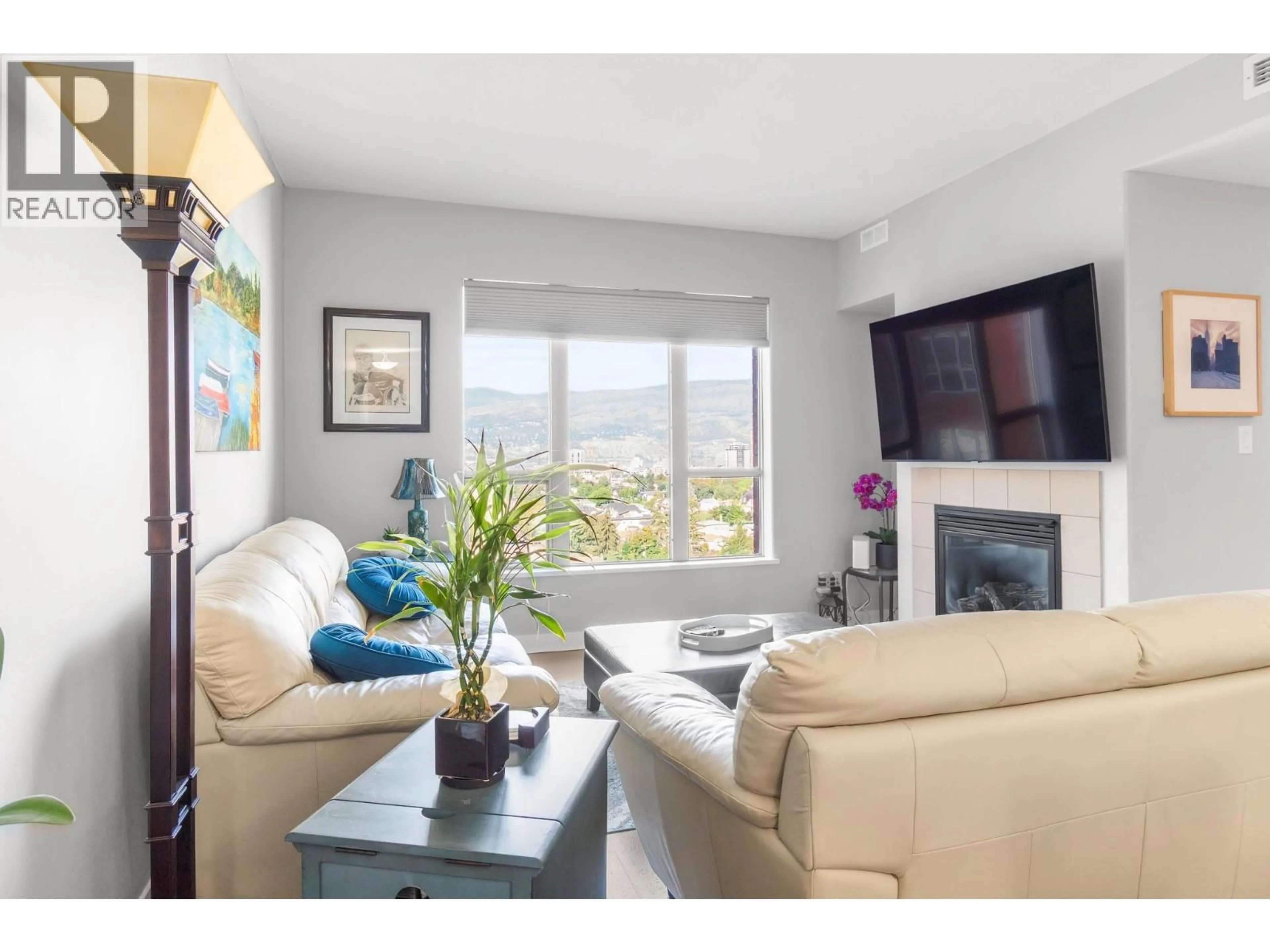 Living room with furniture, wood/laminate floor for 1203 - 1160 BERNARD AVENUE, Kelowna British Columbia V1Y6R2