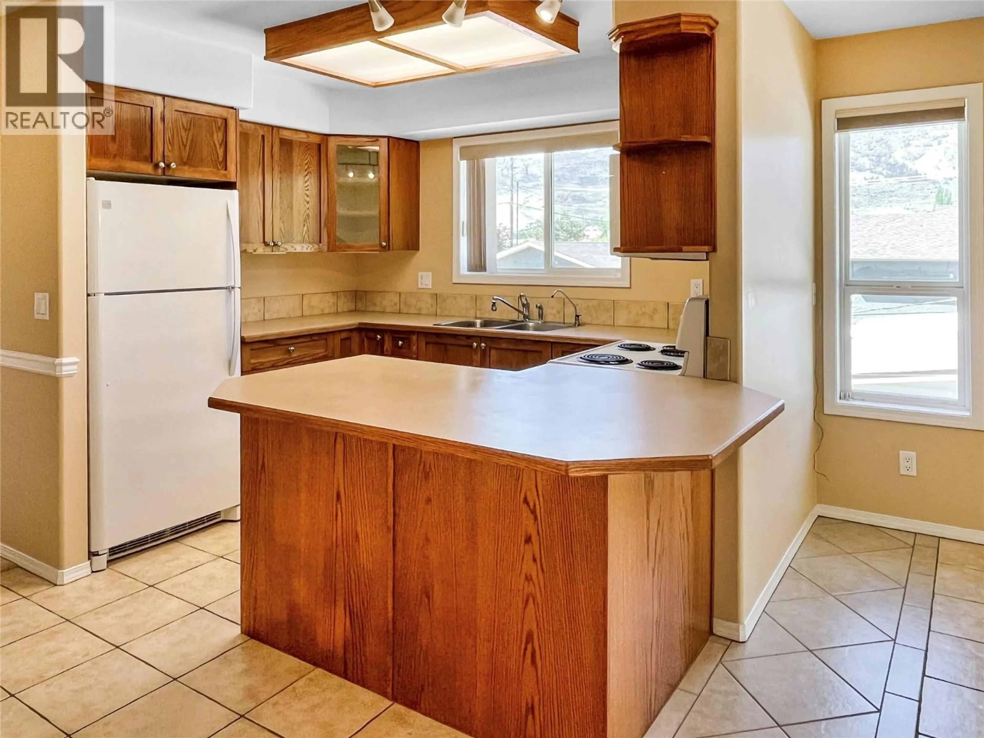 Standard kitchen, ceramic/tile floor for 4 8507 70TH AVENUE, Osoyoos British Columbia V0H1V0