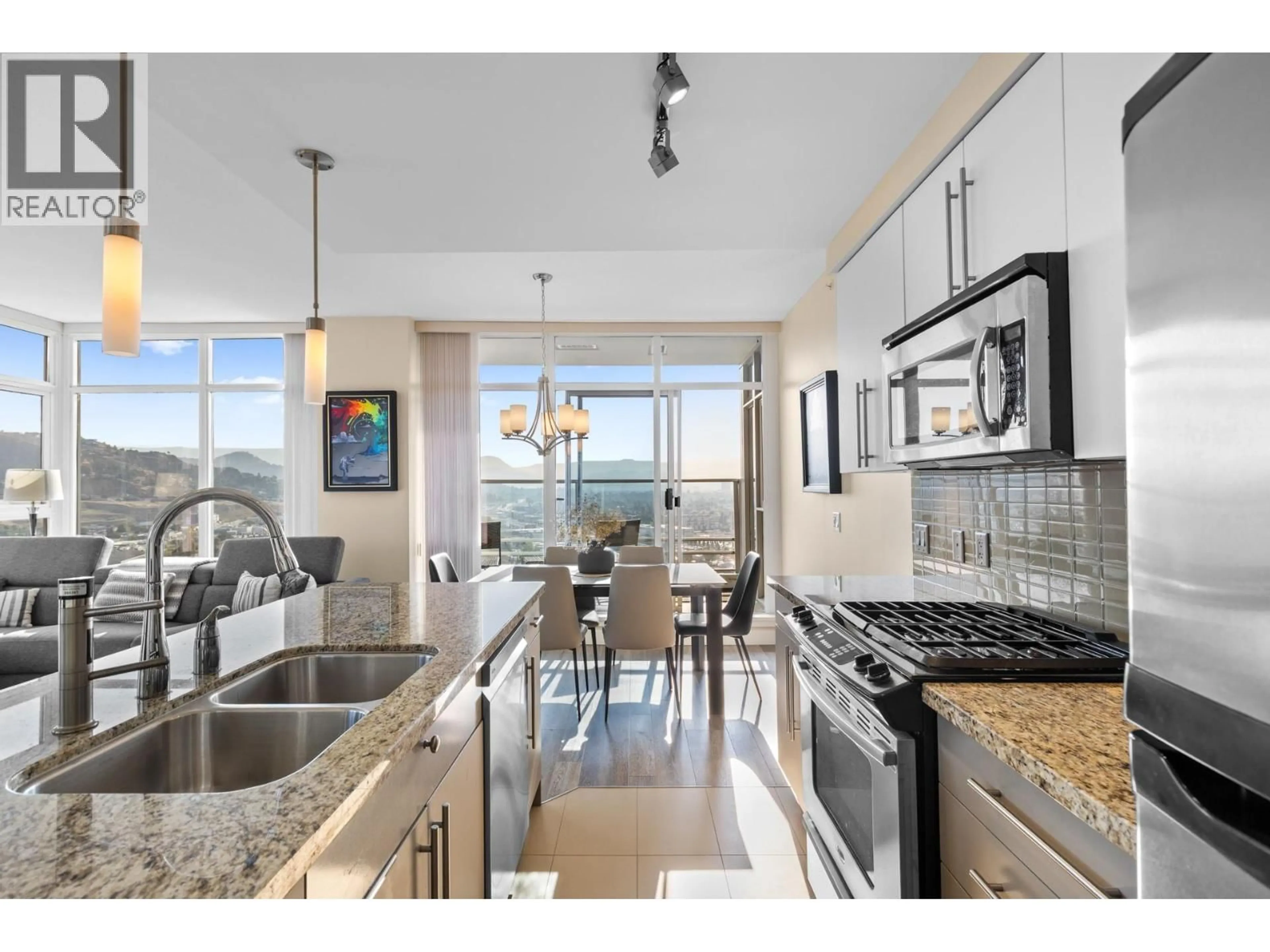 Open concept kitchen, ceramic/tile floor for 2103 - 1075 SUNSET DRIVE, Kelowna British Columbia V1Y9Y9