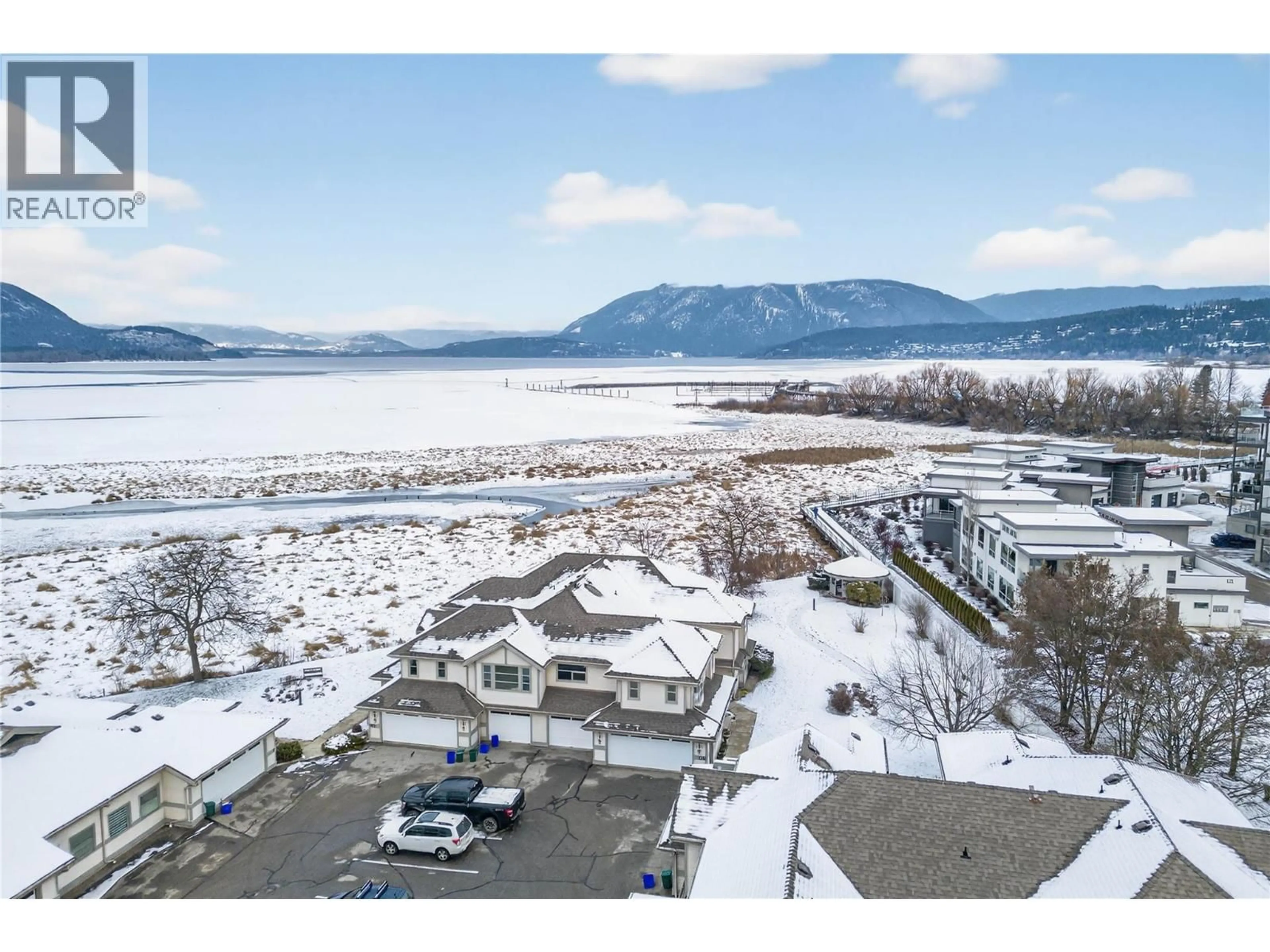 A pic from outside/outdoor area/front of a property/back of a property/a pic from drone, water/lake/river/ocean view for 8 - 111 HARBOURFRONT DRIVE NORTHWEST, Salmon Arm British Columbia V1E1A3