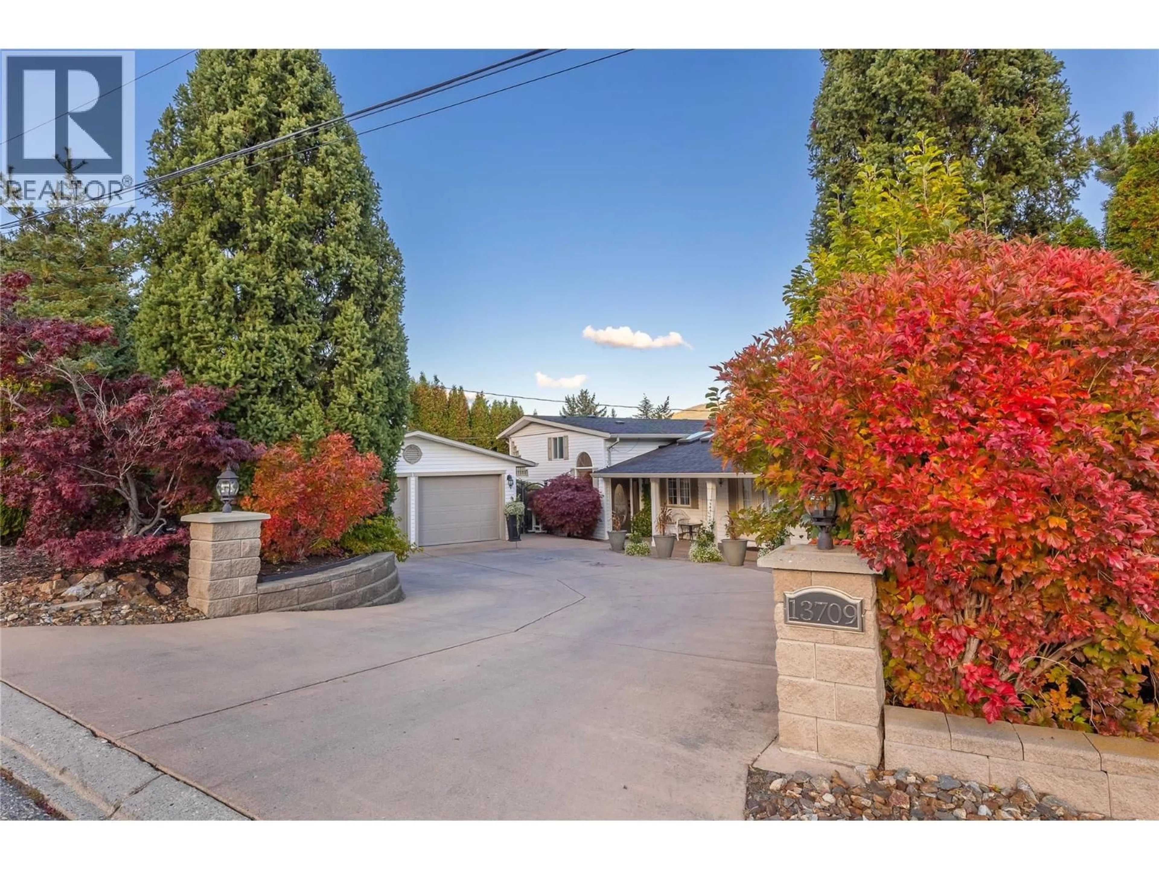 A pic from outside/outdoor area/front of a property/back of a property/a pic from drone, street for 13709 NASH DRIVE, Coldstream British Columbia V1B1X9