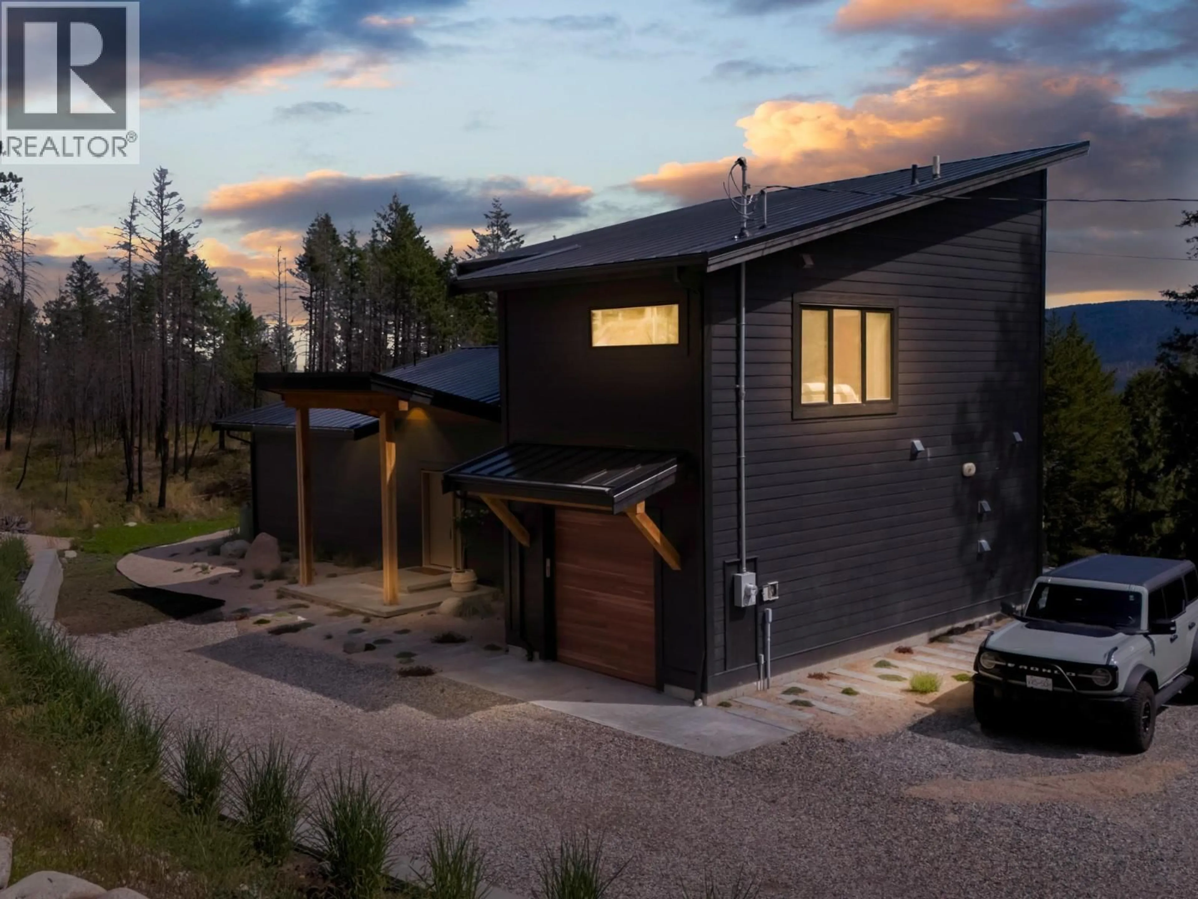 Home with brick exterior material, street for 9485 HOUGHTON ROAD, Fintry British Columbia V1T7Z3