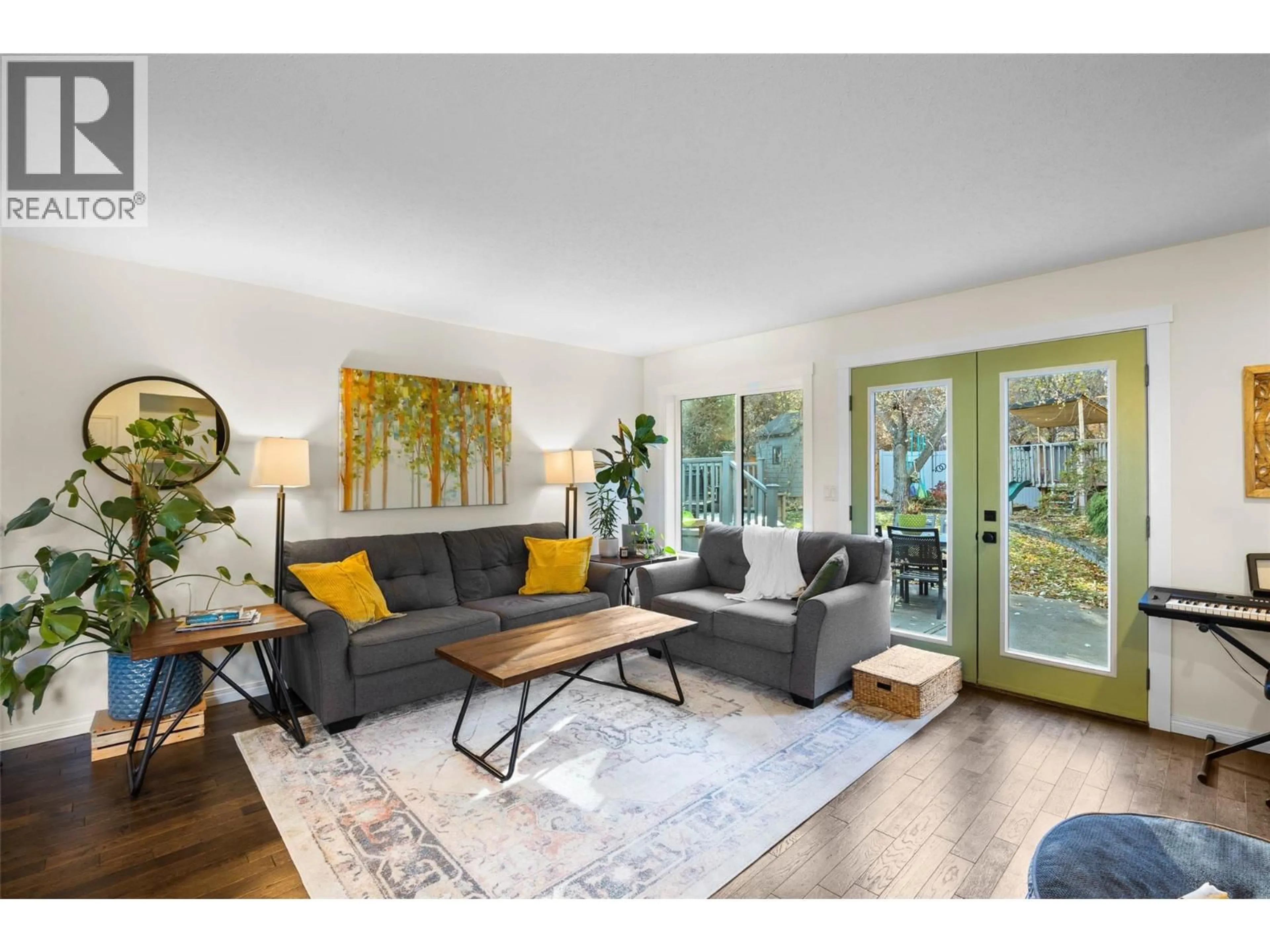 Living room with furniture, wood/laminate floor for 1912 THE PINNACLES OTHER, Kamloops British Columbia V2E2L3