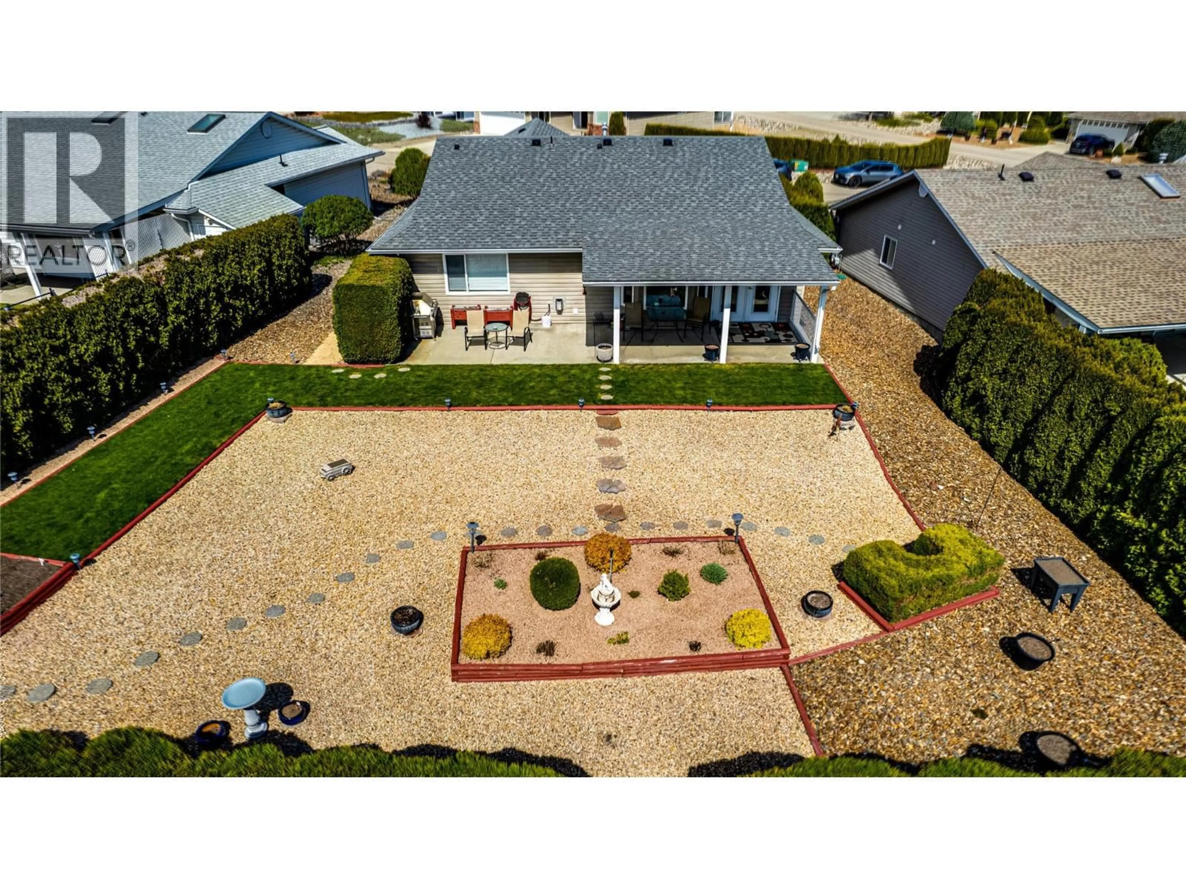 A pic from outside/outdoor area/front of a property/back of a property/a pic from drone, street for 855 8 AVENUE, Vernon British Columbia V1H1Z1