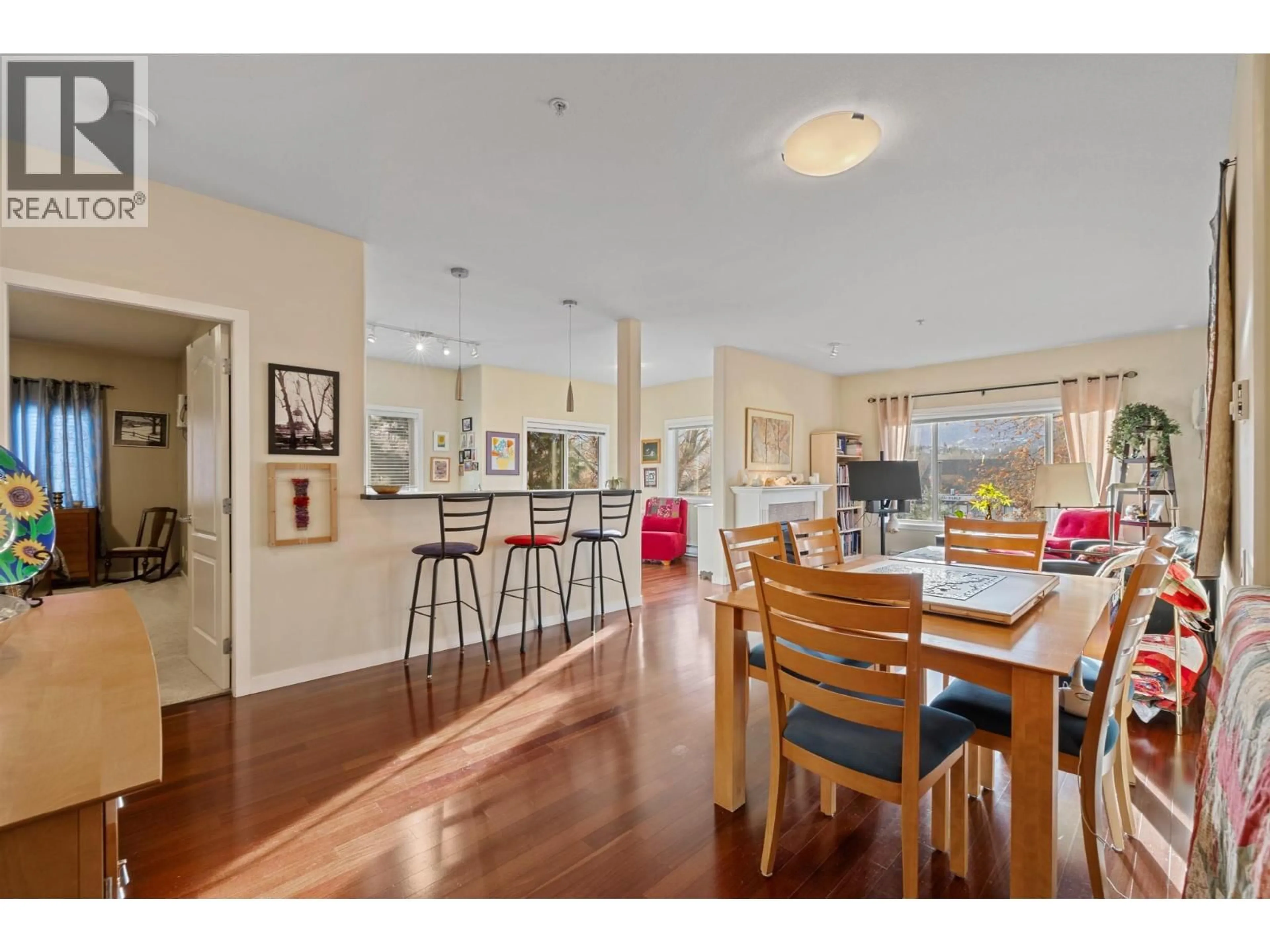 Open concept kitchen, wood/laminate floor for 209 - 680 LEQUIME ROAD, Kelowna British Columbia V1W1A4