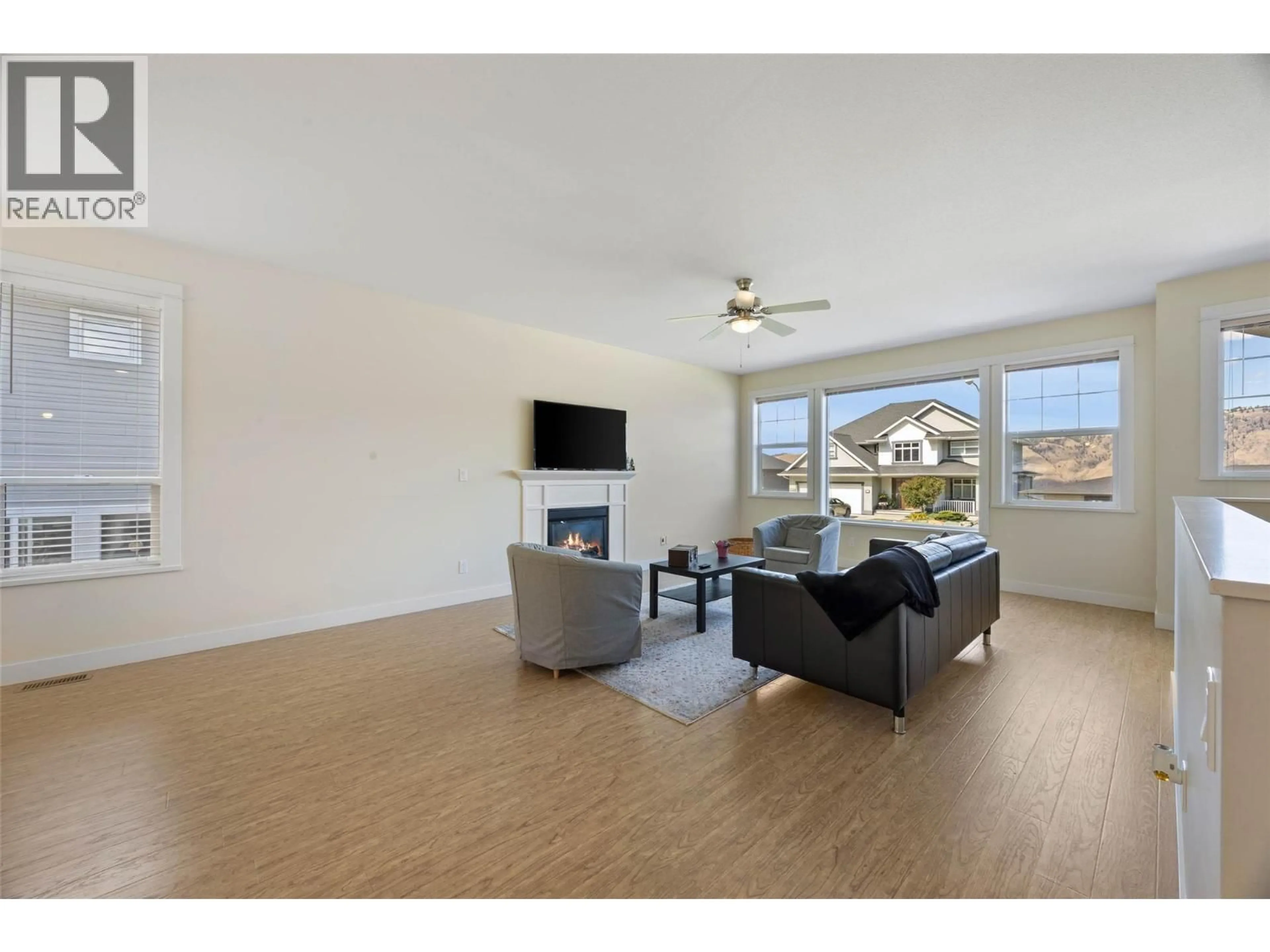 Living room with furniture, wood/laminate floor for 1771 GALORE PLACE, Kamloops British Columbia V2E0A7
