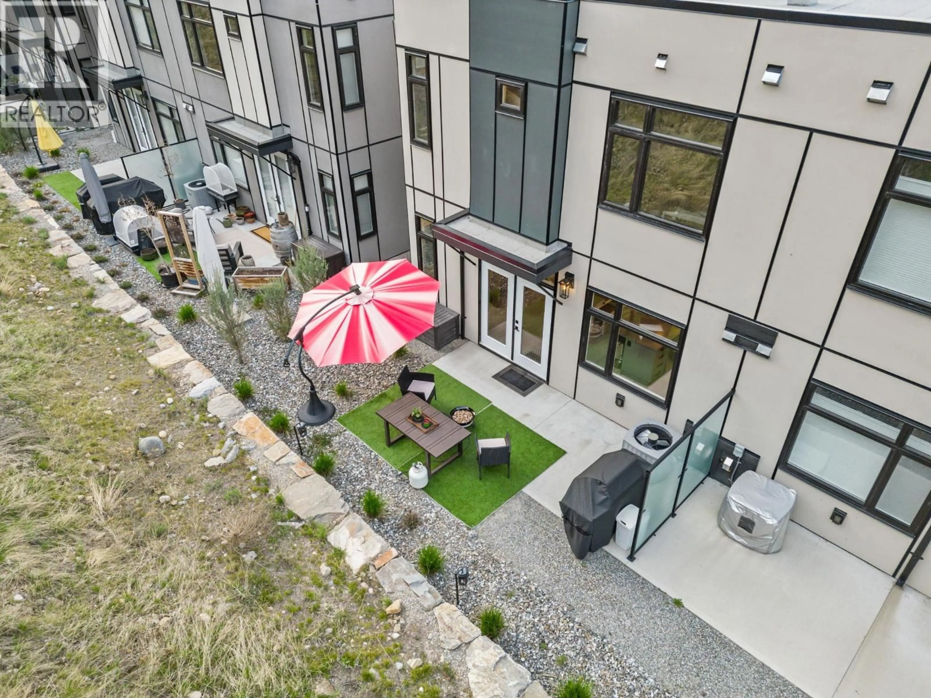 A pic from outside/outdoor area/front of a property/back of a property/a pic from drone, street for 7 - 3220 HILLTOWN DRIVE, Kelowna British Columbia V1V0C6