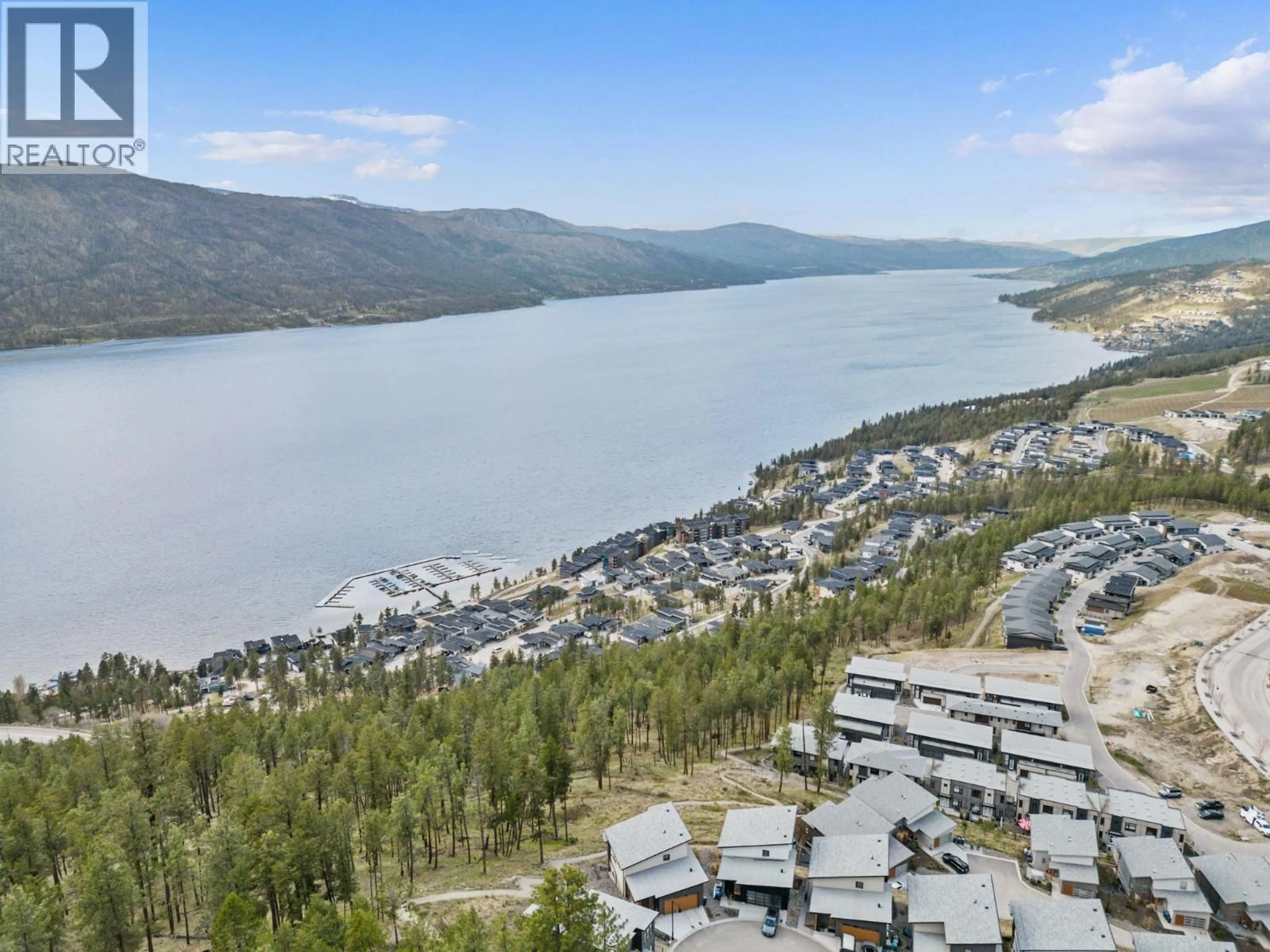 A pic from outside/outdoor area/front of a property/back of a property/a pic from drone, water/lake/river/ocean view for 7 - 3220 HILLTOWN DRIVE, Kelowna British Columbia V1V0C6