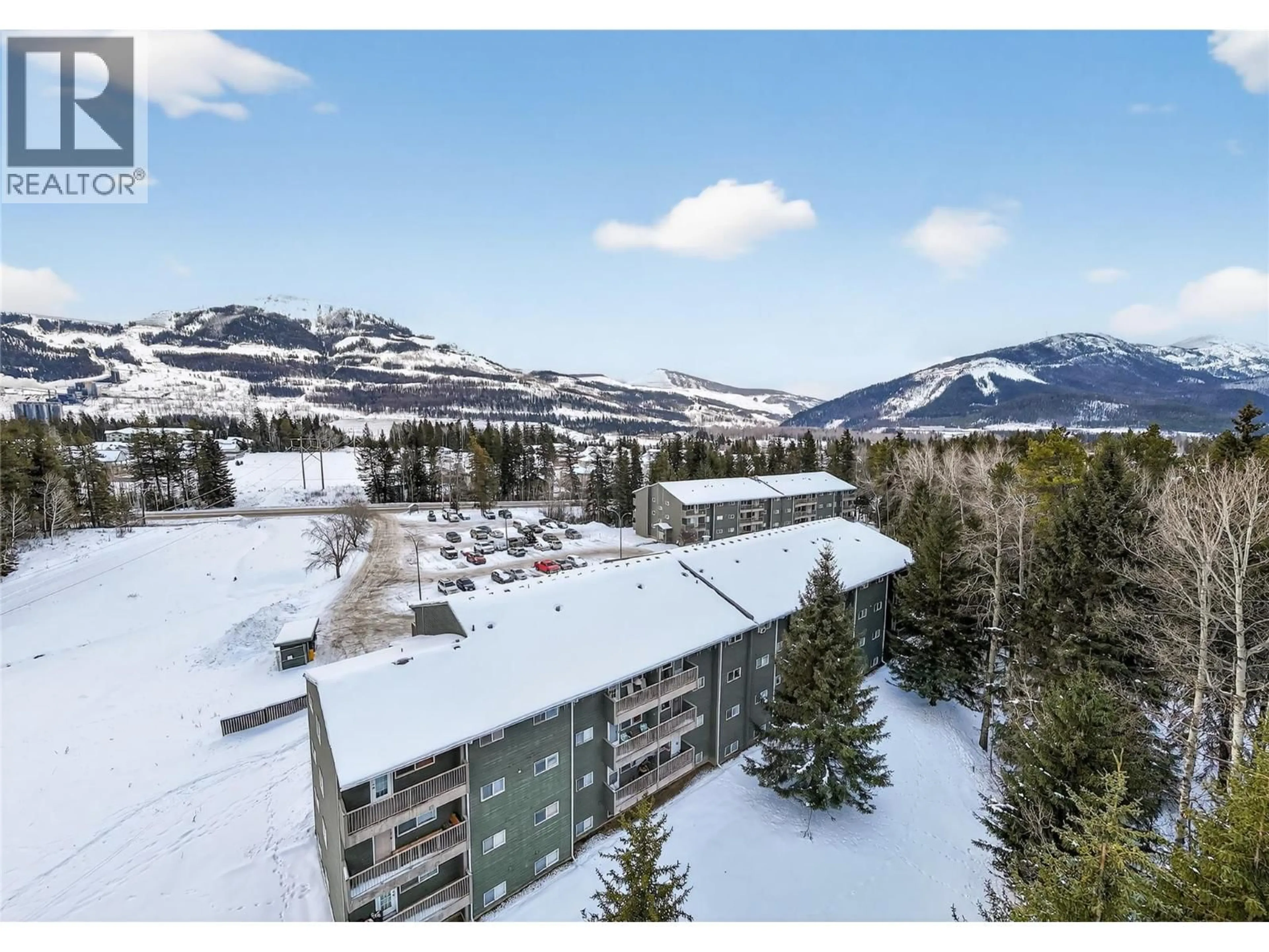 A pic from outside/outdoor area/front of a property/back of a property/a pic from drone, mountain view for 304A - 1299 PONDEROSA DRIVE, Sparwood British Columbia V0B2G2