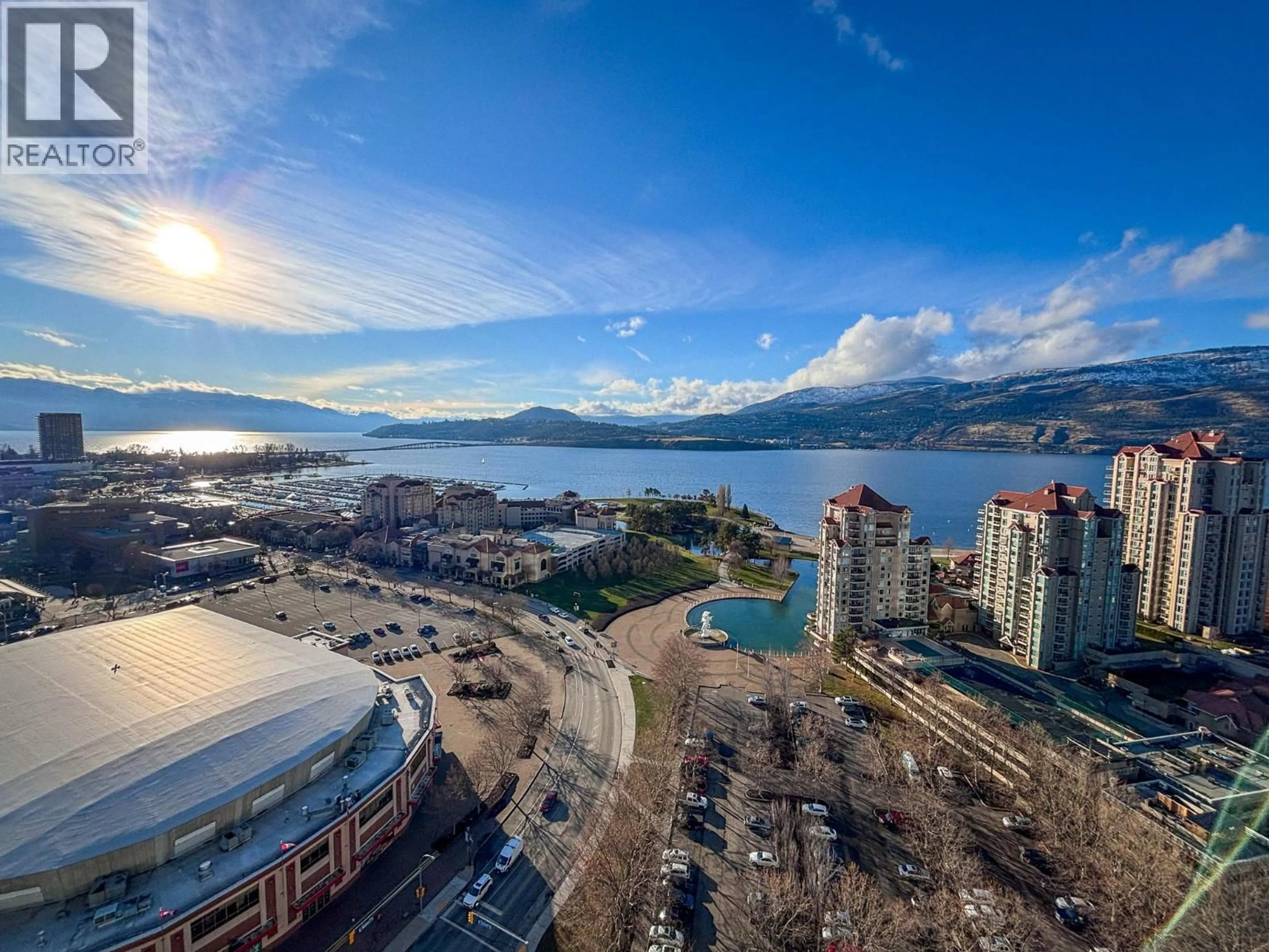 A pic from outside/outdoor area/front of a property/back of a property/a pic from drone, water/lake/river/ocean view for 2205 - 1191 SUNSET DRIVE, Kelowna British Columbia V1Y0J4