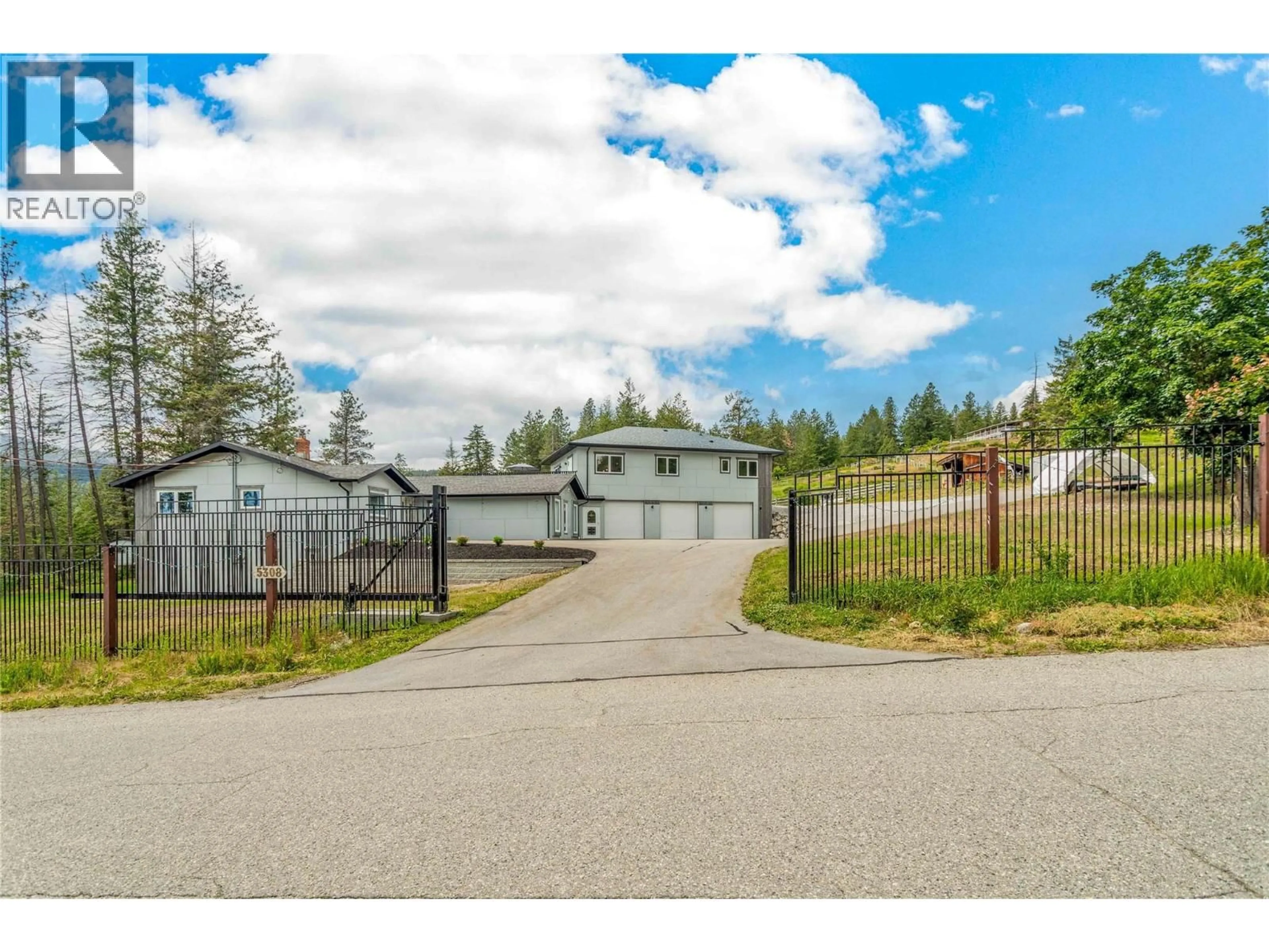 A pic from outside/outdoor area/front of a property/back of a property/a pic from drone, street for 5308 LAW STREET, Peachland British Columbia V0H1X8