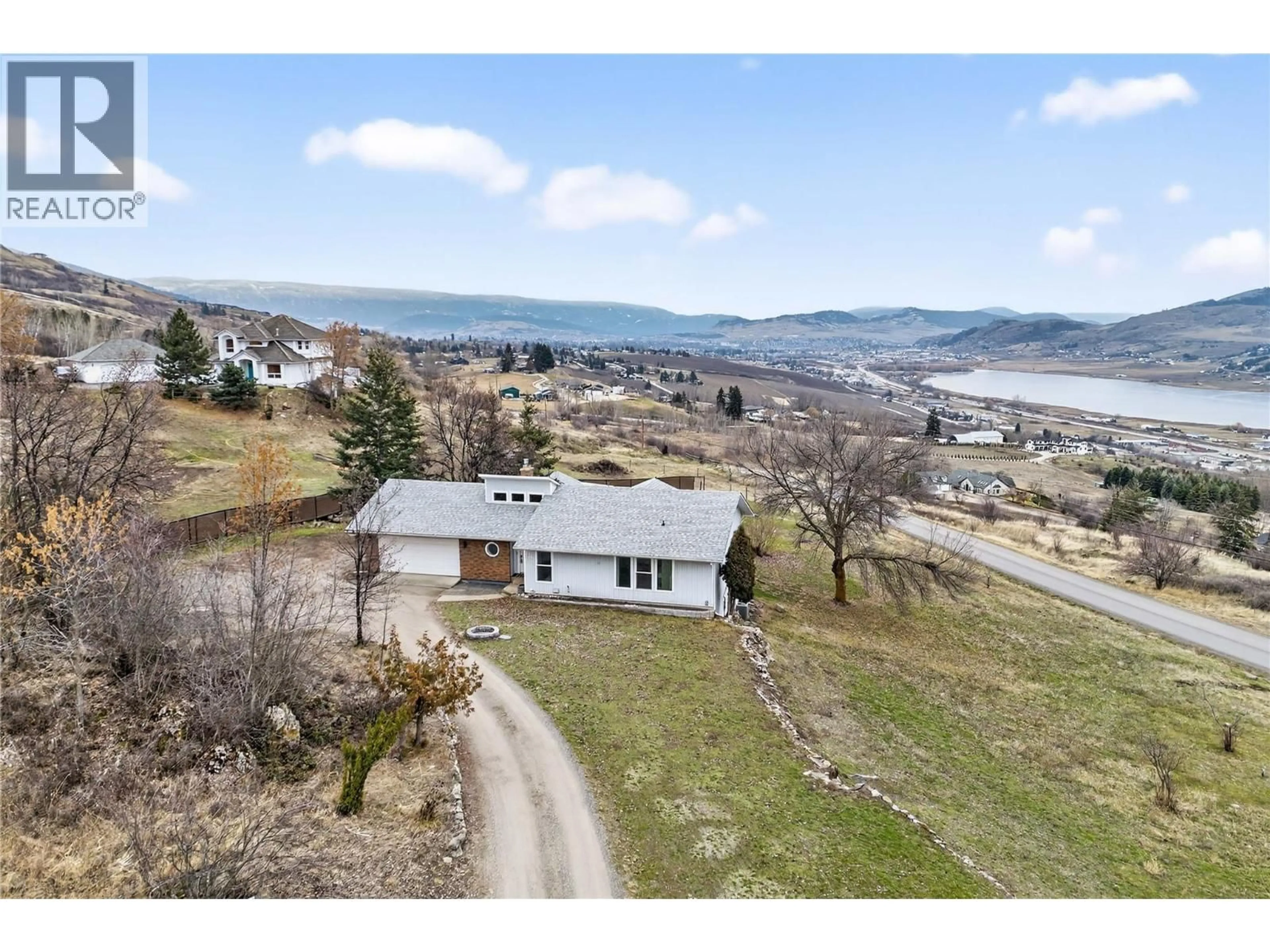 A pic from outside/outdoor area/front of a property/back of a property/a pic from drone, mountain view for 7292 MOUNTRIDGE ROAD, Vernon British Columbia V1B3S8