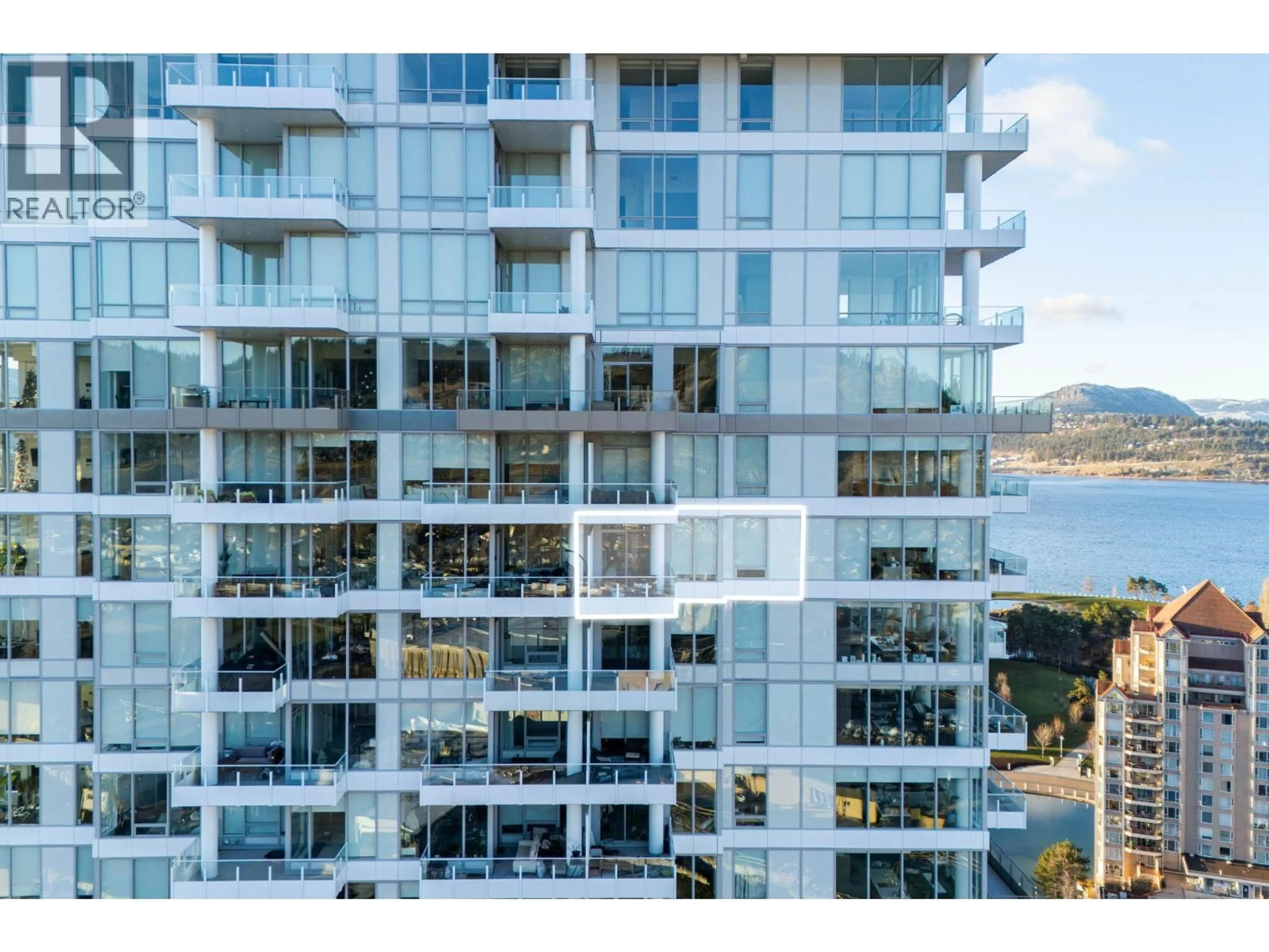 A pic from outside/outdoor area/front of a property/back of a property/a pic from drone, water/lake/river/ocean view for 2307 - 1181 SUNSET DRIVE, Kelowna British Columbia V1Y0L4