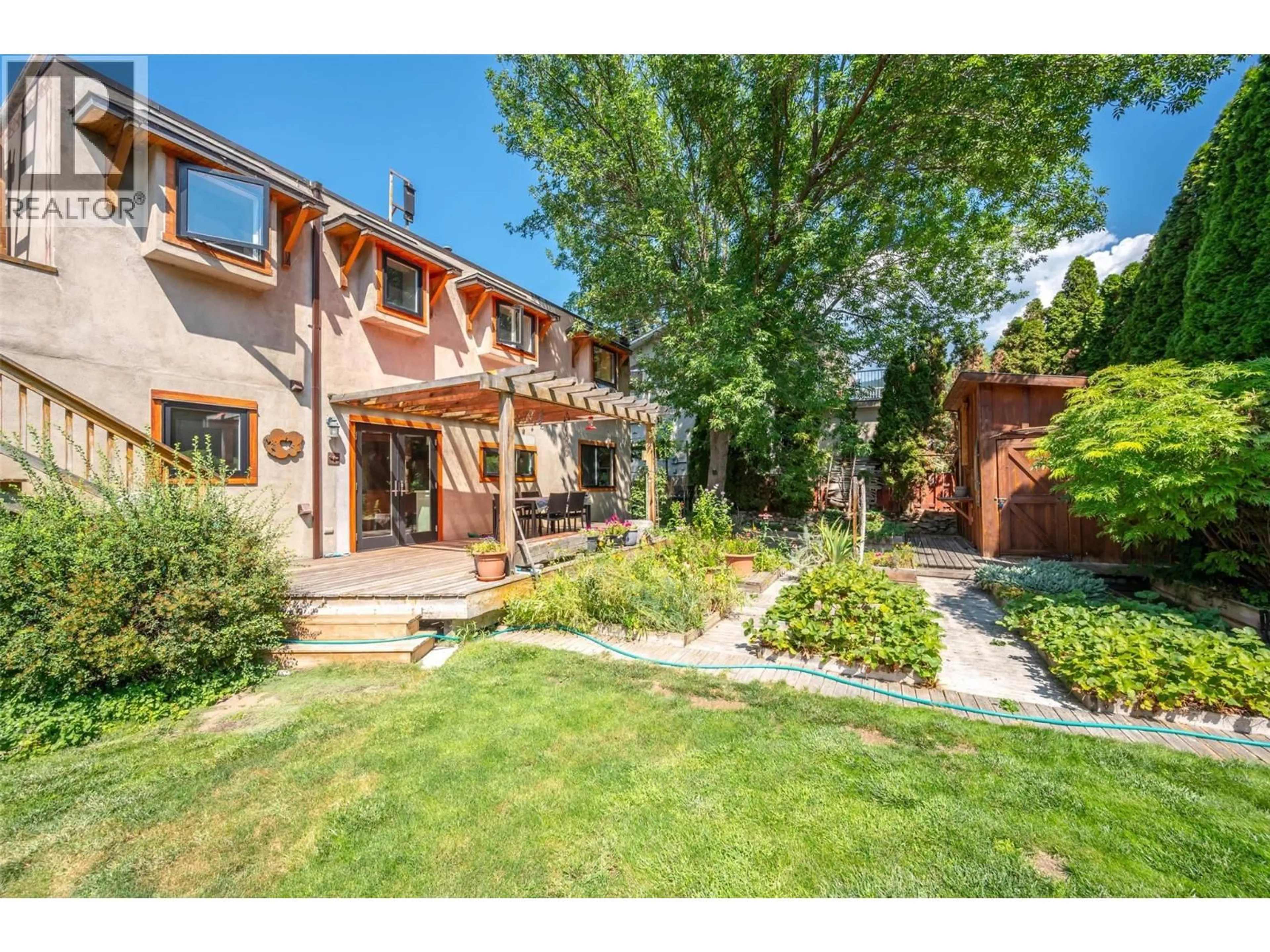 A pic from outside/outdoor area/front of a property/back of a property/a pic from drone, street for 830 THREE MILE ROAD, Penticton British Columbia V2A8T7