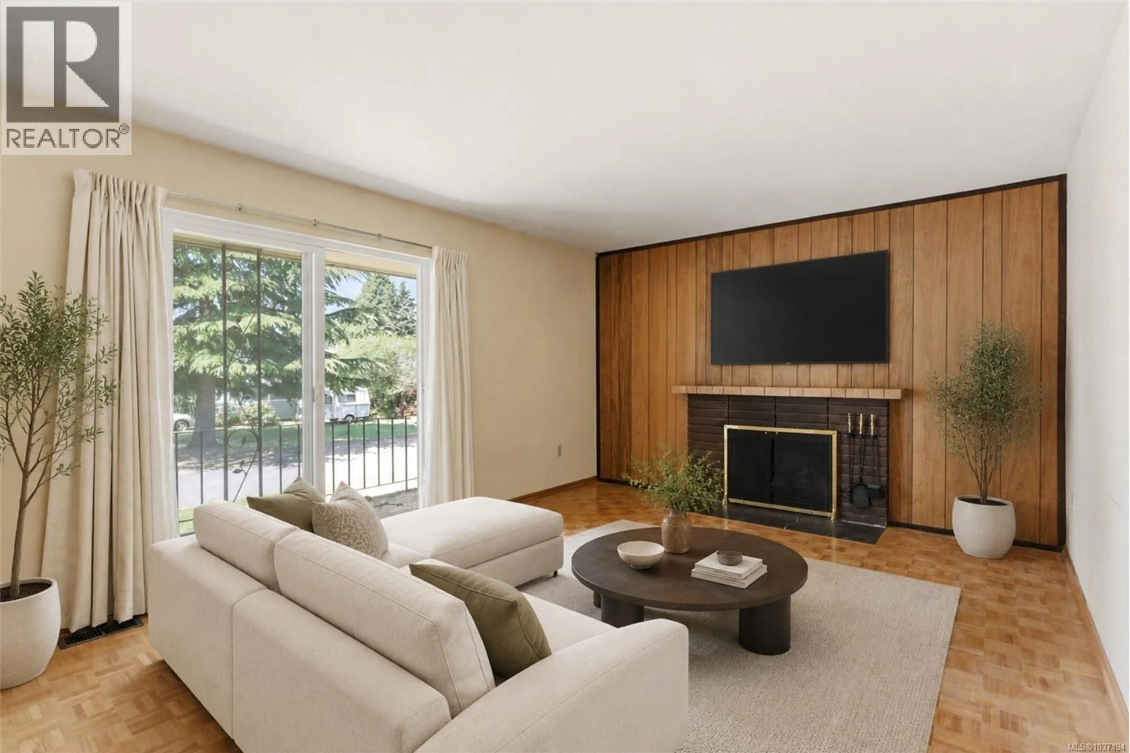Living room with furniture, wood/laminate floor for 4021 MAGDELIN STREET, Saanich British Columbia V8N3M6