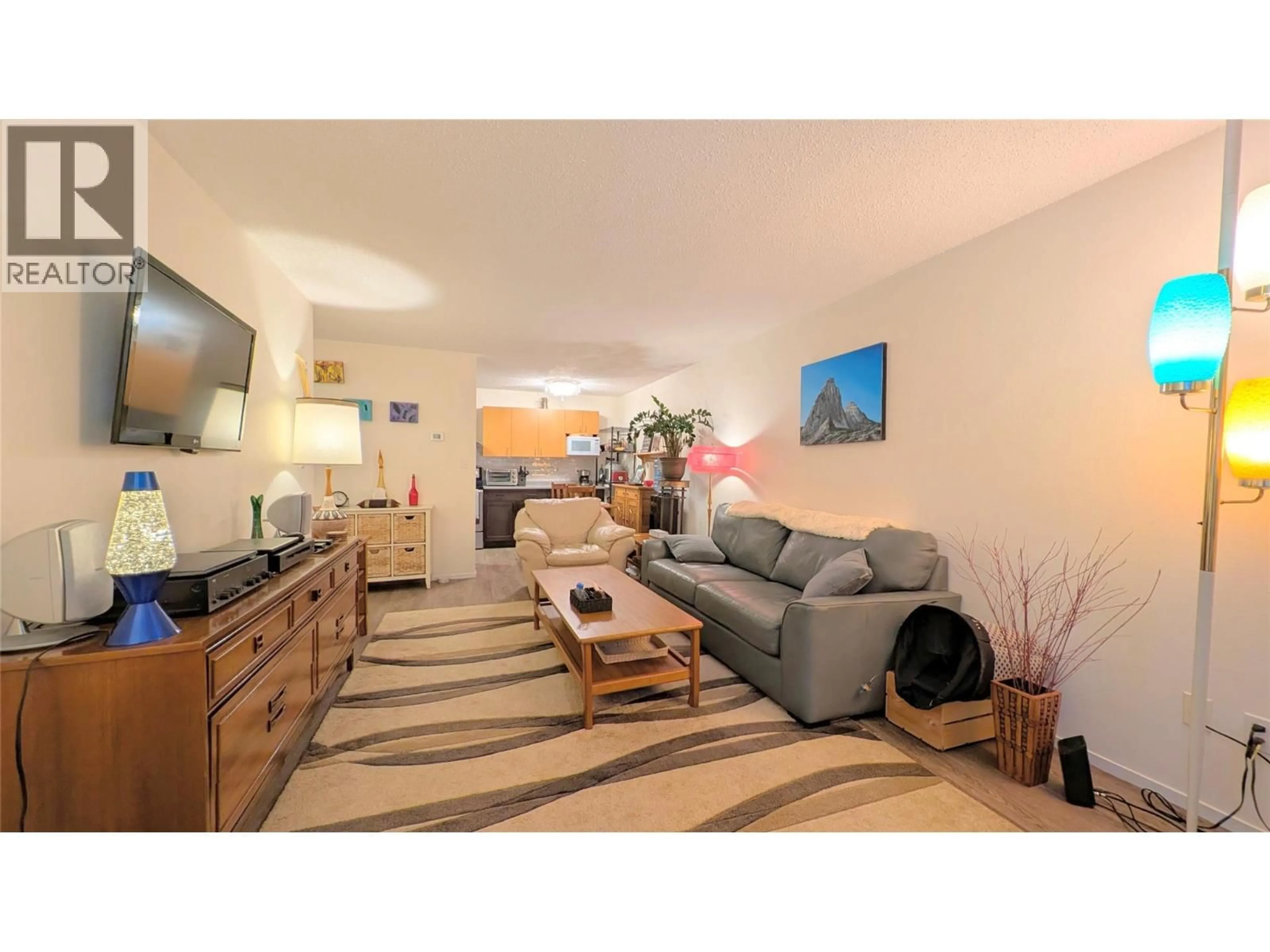 Living room with furniture, wood/laminate floor for 1203 - 2015 2ND STREET NORTH, Cranbrook British Columbia V1C3L4