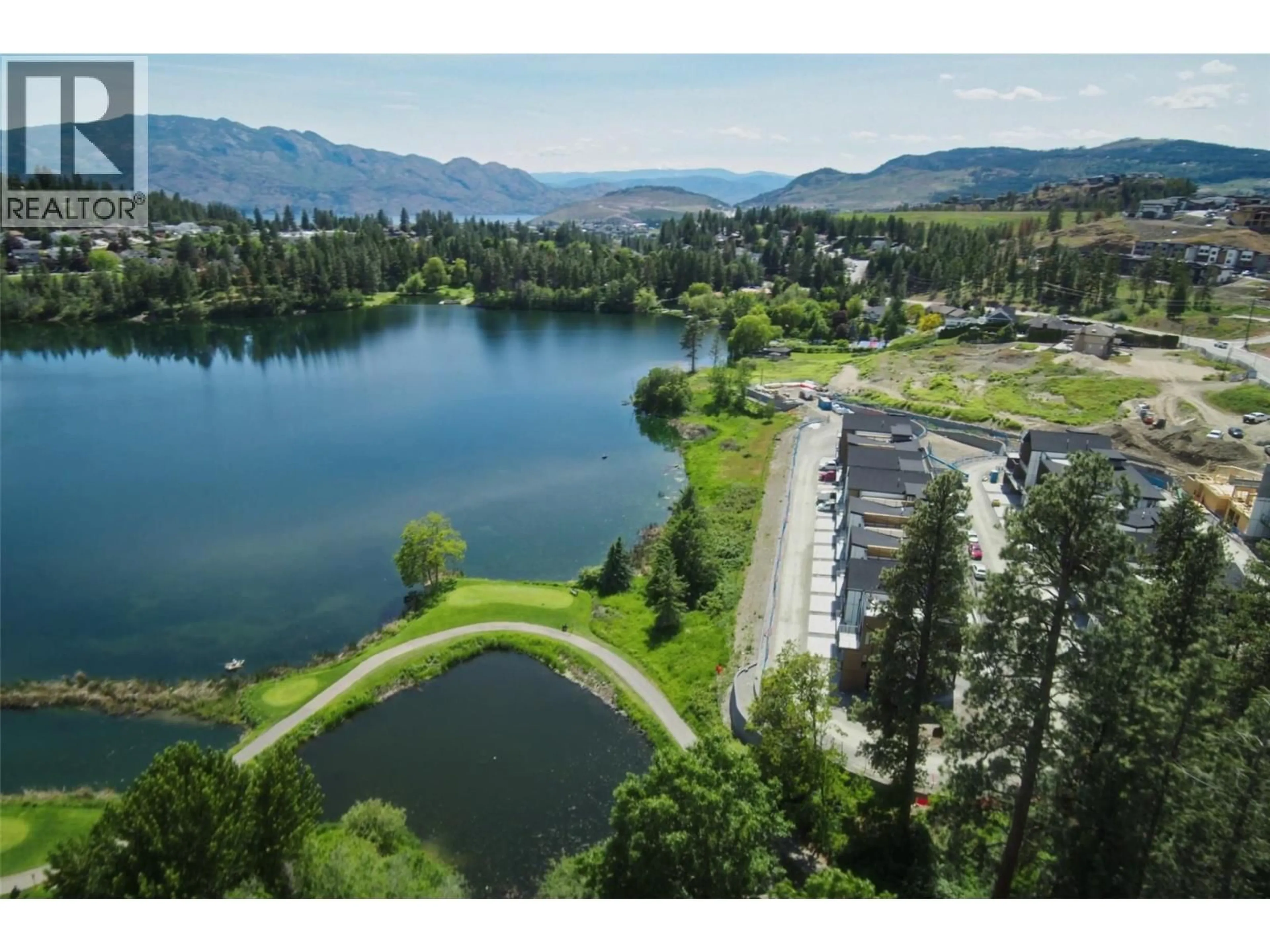 A pic from outside/outdoor area/front of a property/back of a property/a pic from drone, water/lake/river/ocean view for 203 - 2735 SHANNON LAKE ROAD, West Kelowna British Columbia V4T1V6