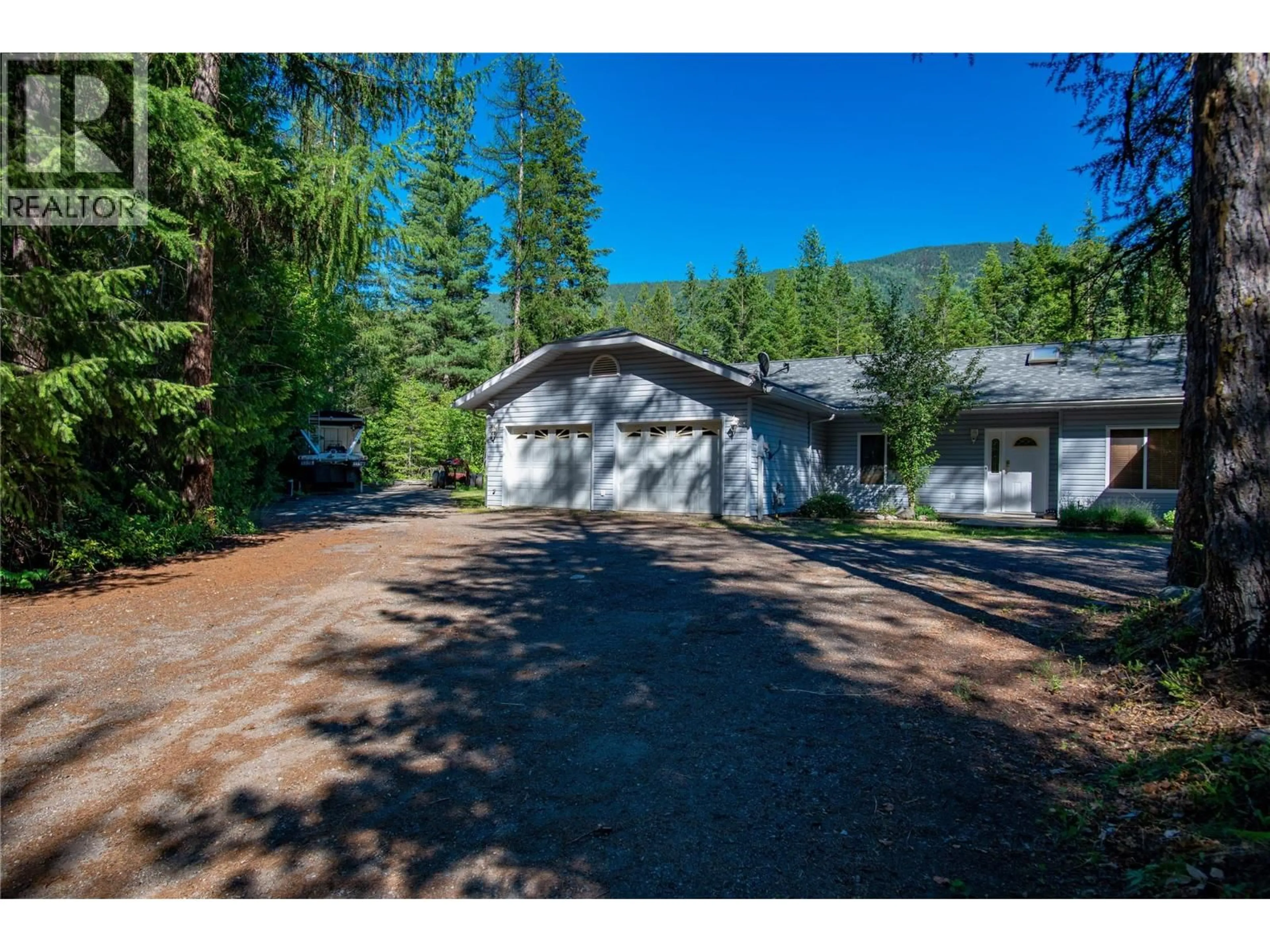 A pic from outside/outdoor area/front of a property/back of a property/a pic from drone, mountain view for 2222 JENISA ROAD, Castlegar British Columbia V1N2L8