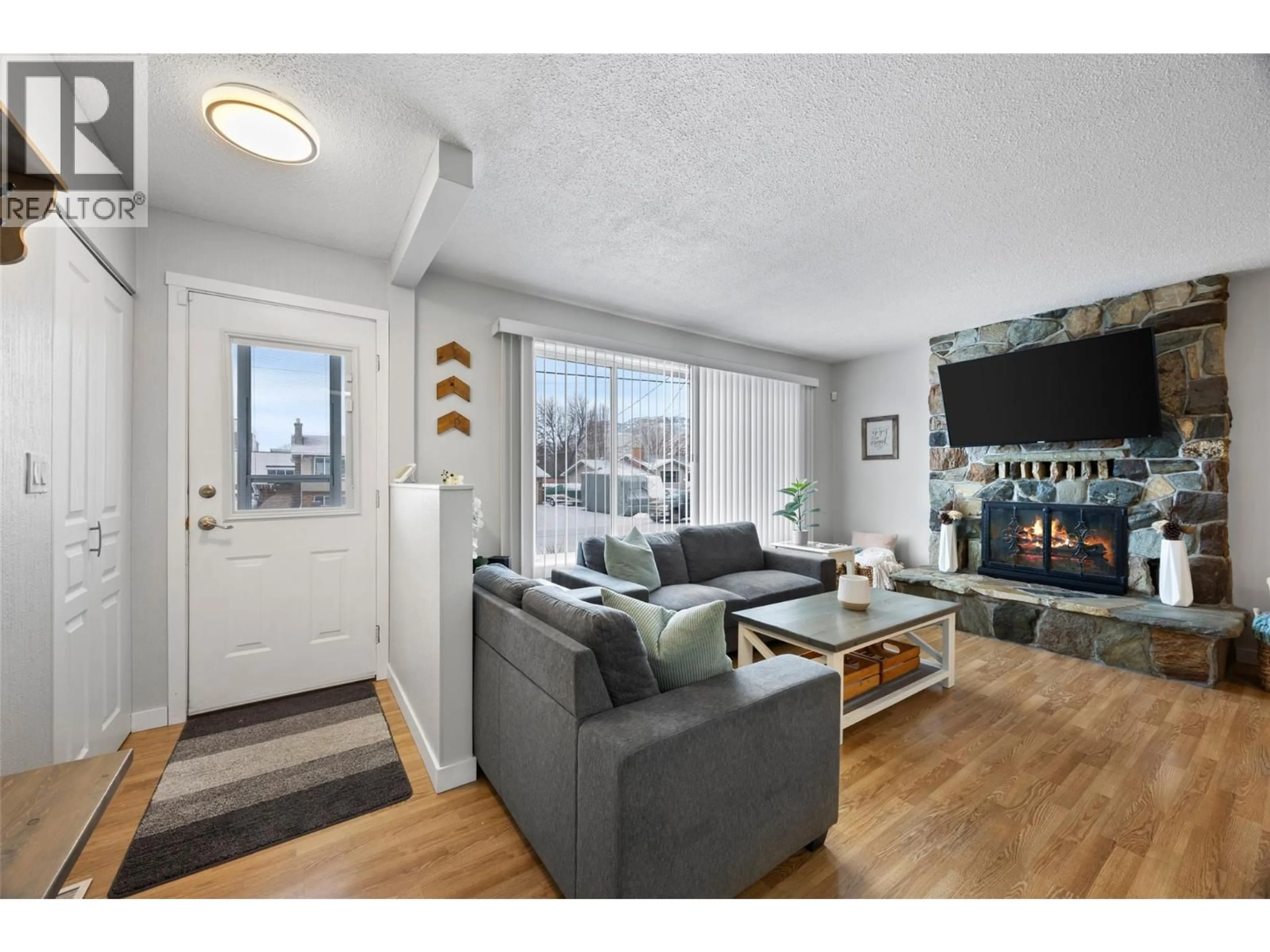 Living room with furniture, wood/laminate floor for 1139 CHATEAU STREET, Kamloops British Columbia V2B5R3