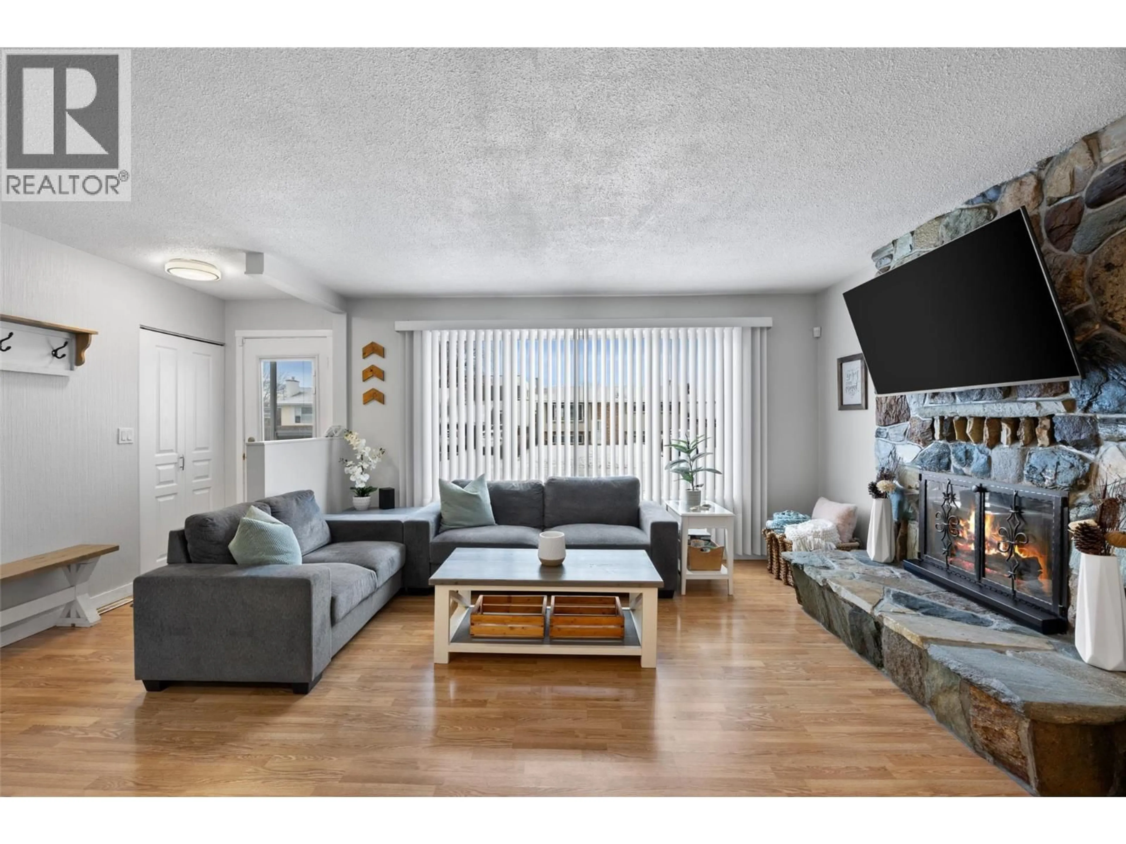 Living room with furniture, wood/laminate floor for 1139 CHATEAU STREET, Kamloops British Columbia V2B5R3