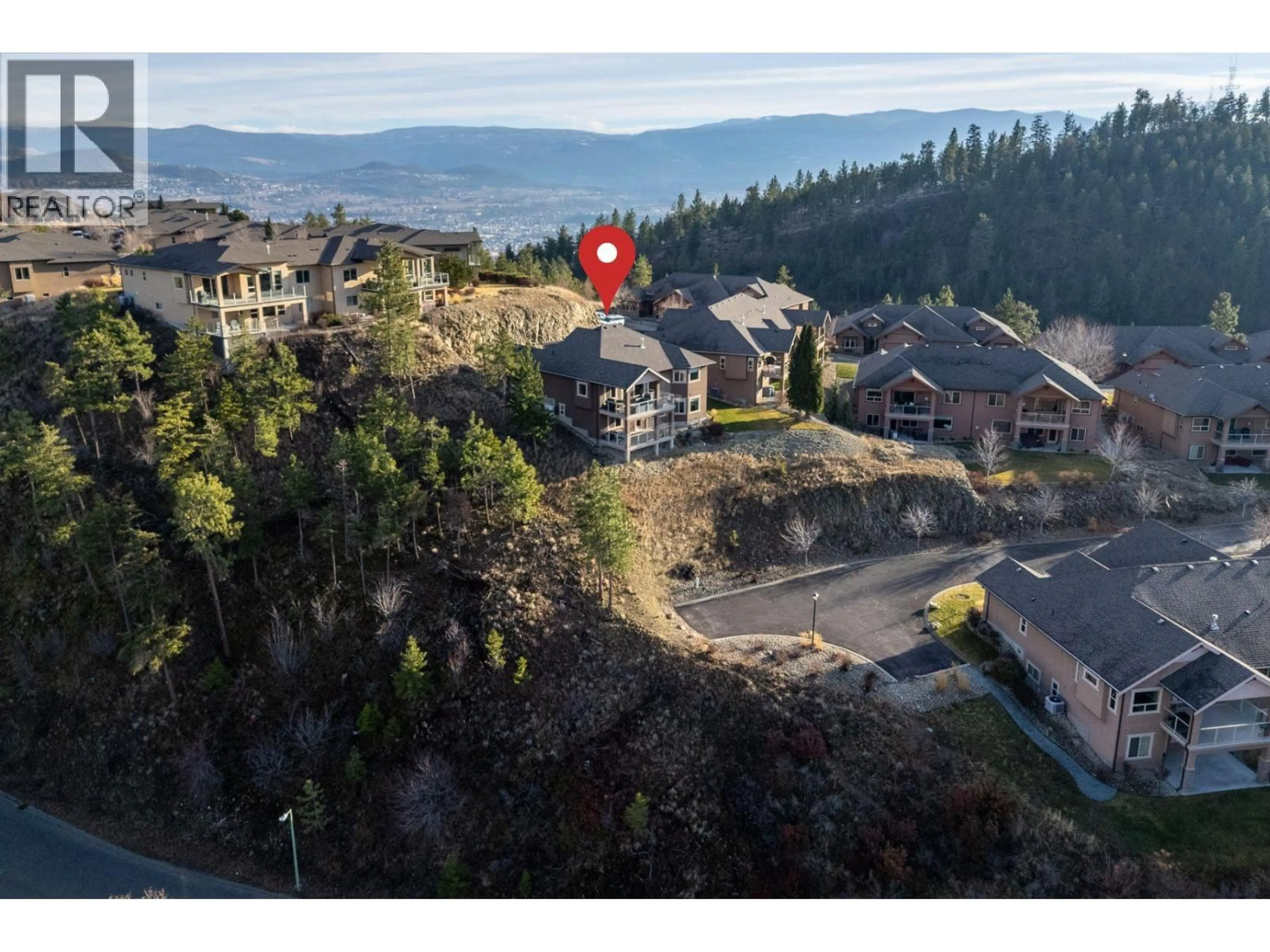A pic from outside/outdoor area/front of a property/back of a property/a pic from drone, mountain view for 16 - 2450 SELKIRK DRIVE, Kelowna British Columbia V1V2Z5