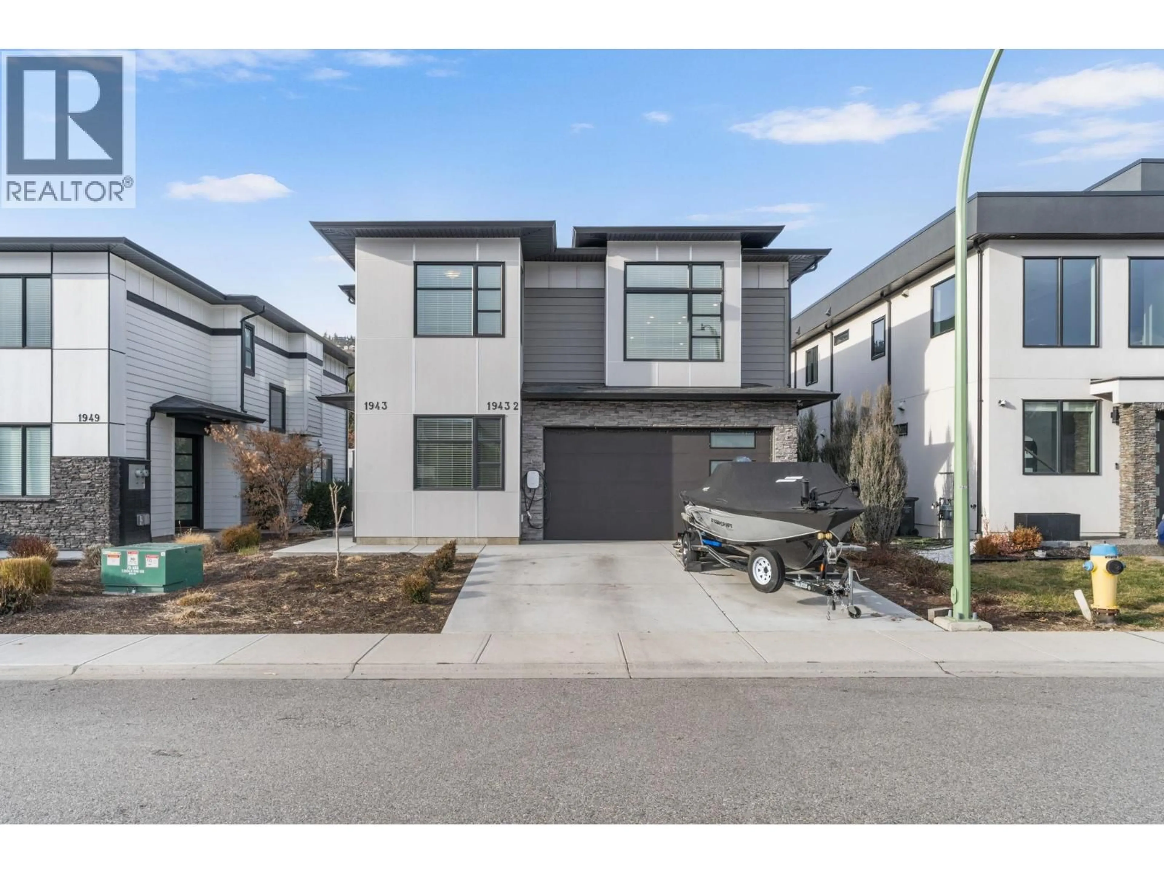 Home with brick exterior material, street for 1943 HEMMERLING COURT, Kelowna British Columbia V1V1X1