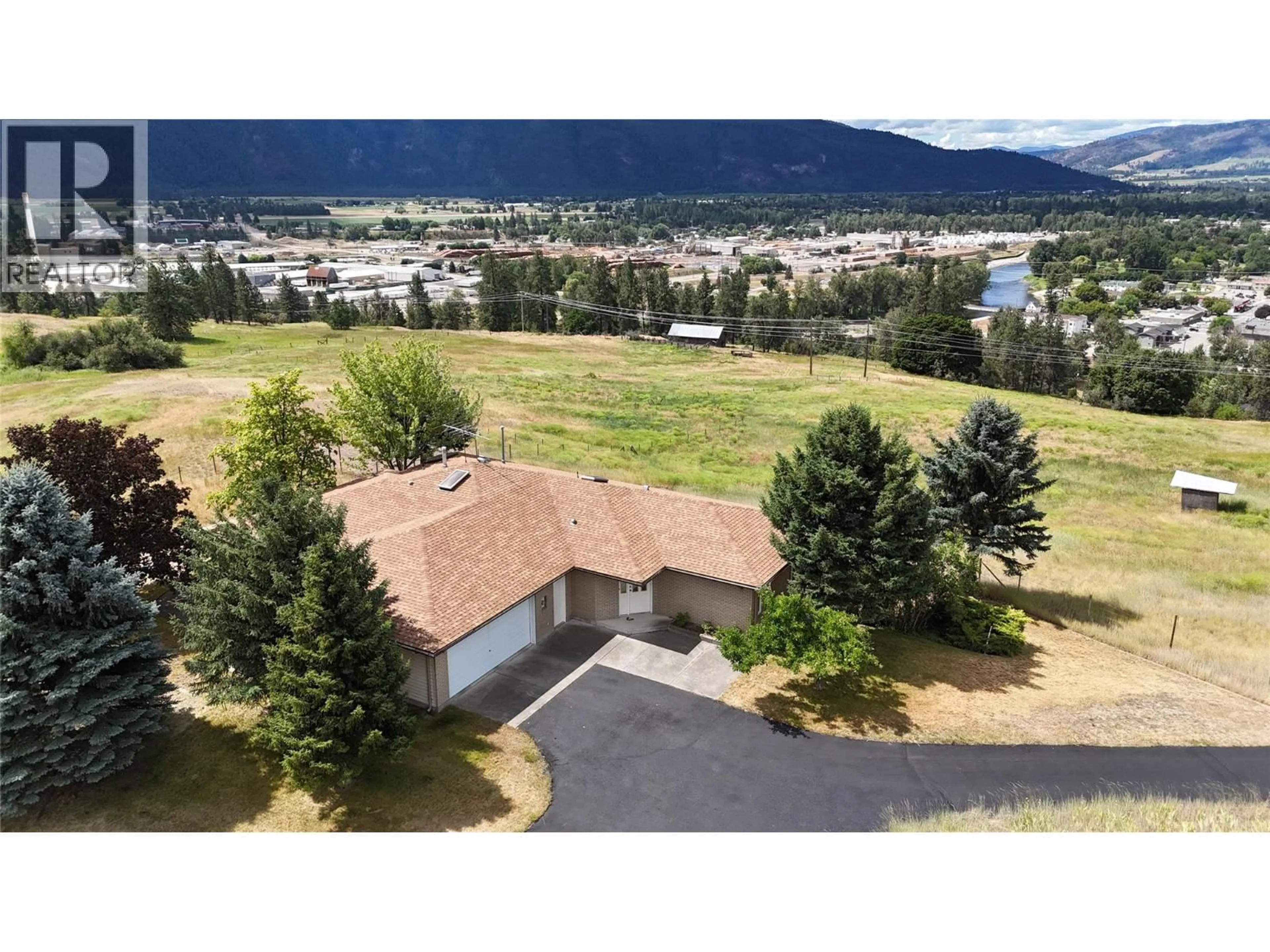 A pic from outside/outdoor area/front of a property/back of a property/a pic from drone, mountain view for 210 WINNIPEG AVENUE, Grand Forks British Columbia V0H1H0