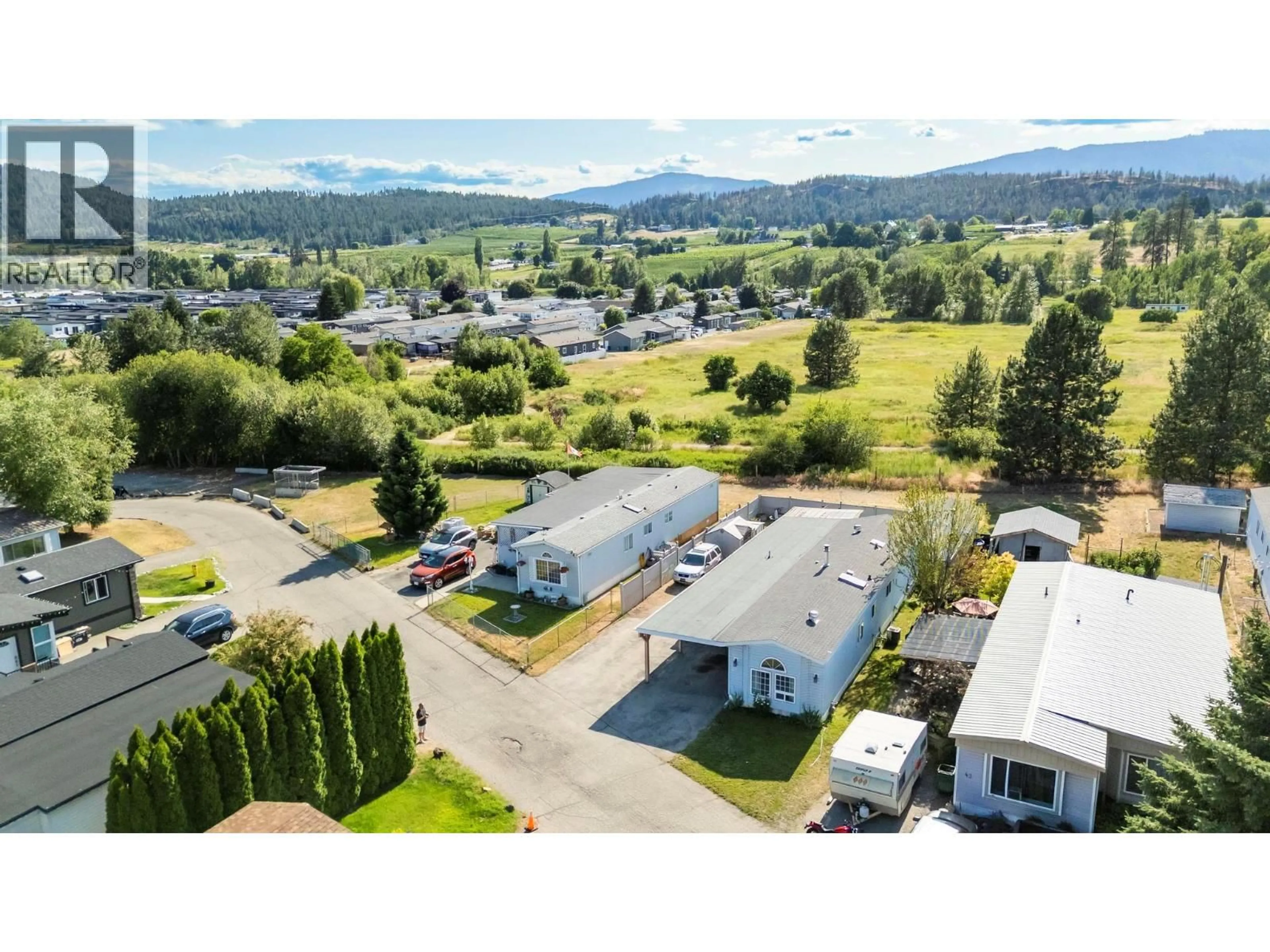 A pic from outside/outdoor area/front of a property/back of a property/a pic from drone, mountain view for 44 - 9020 JIM BAILEY ROAD, Kelowna British Columbia V4V1E3