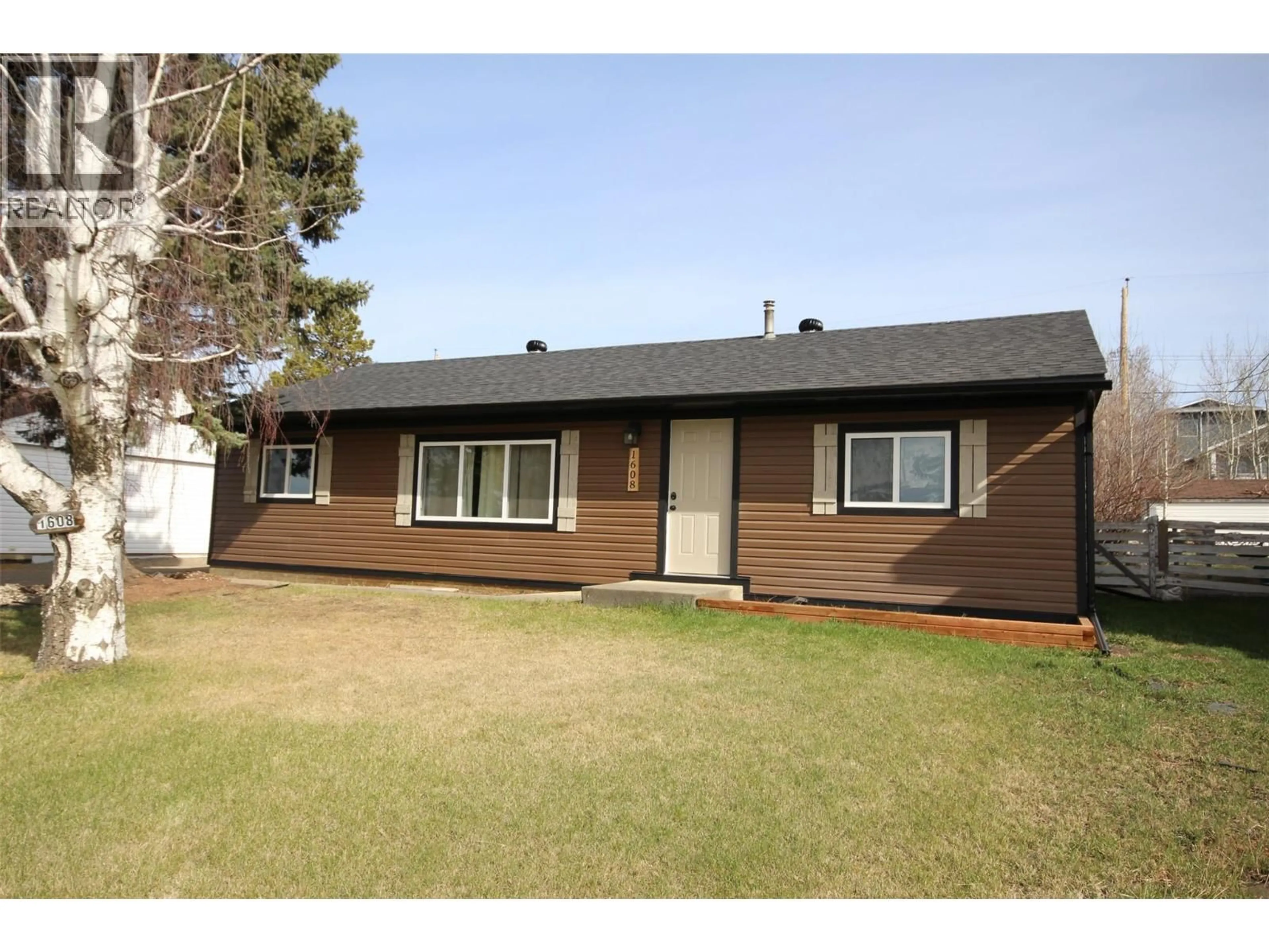 Home with vinyl exterior material, street for 1608 95 AVENUE, Dawson Creek British Columbia V1G1K1