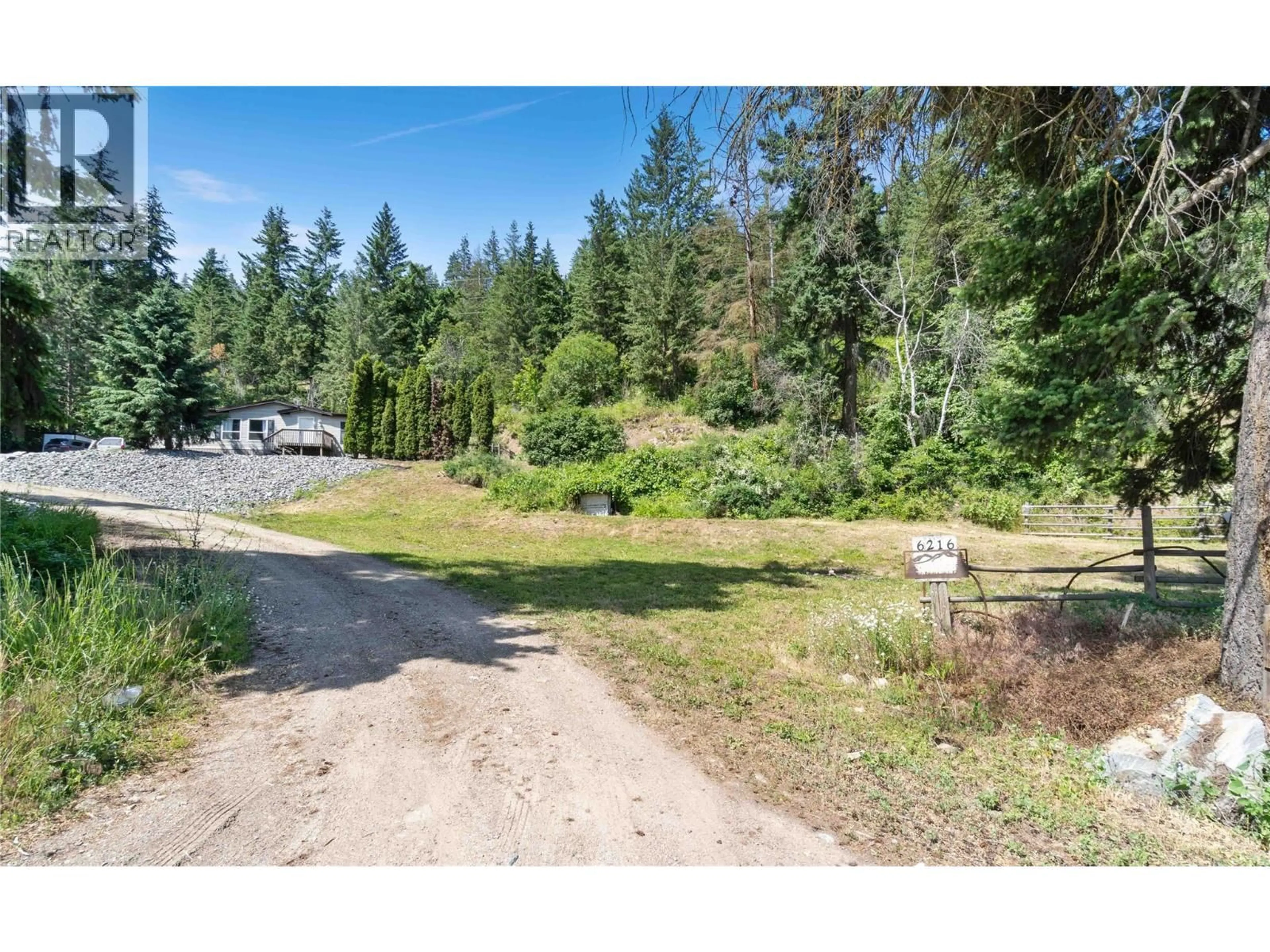 A pic from outside/outdoor area/front of a property/back of a property/a pic from drone, forest/trees view for 6216 97A HIGHWAY, Enderby British Columbia V0E1V3