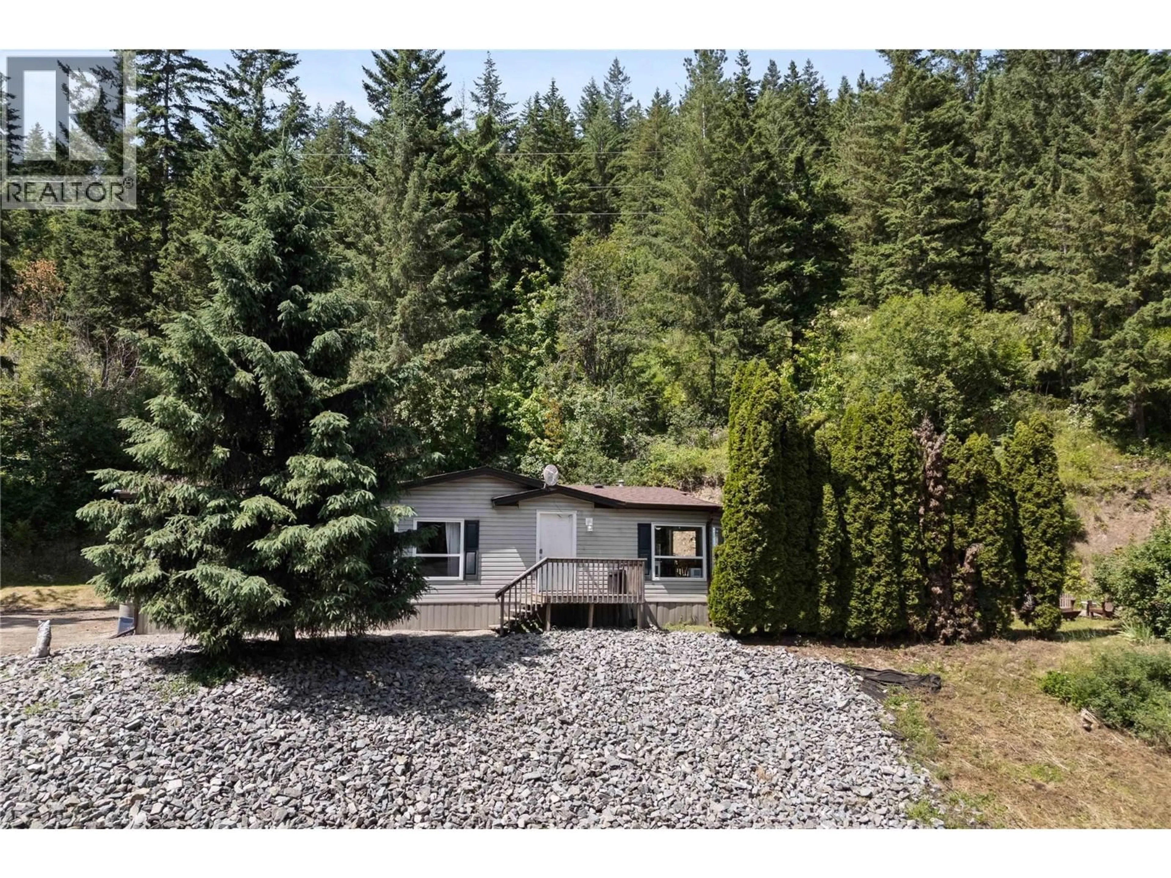 A pic from outside/outdoor area/front of a property/back of a property/a pic from drone, forest/trees view for 6216 97A HIGHWAY, Enderby British Columbia V0E1V3
