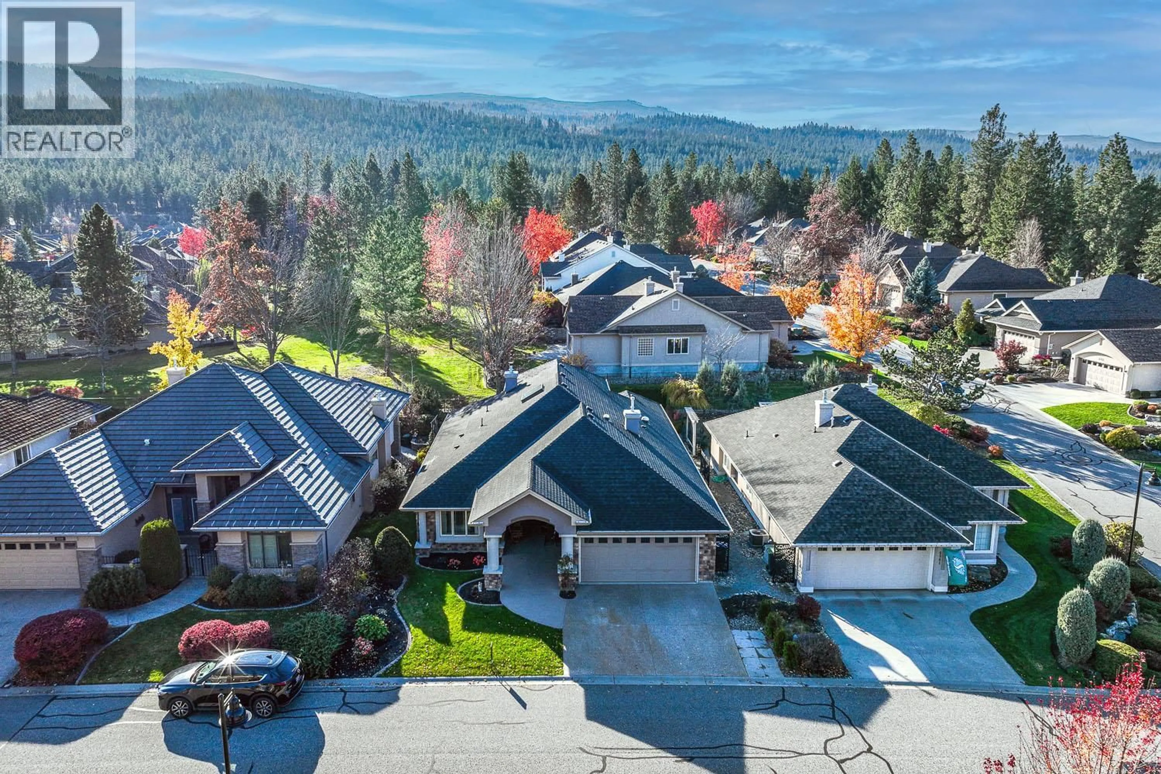 A pic from outside/outdoor area/front of a property/back of a property/a pic from drone, mountain view for 4345 GALLAGHERS FAIRWAY SOUTH, Kelowna British Columbia V1W4X4