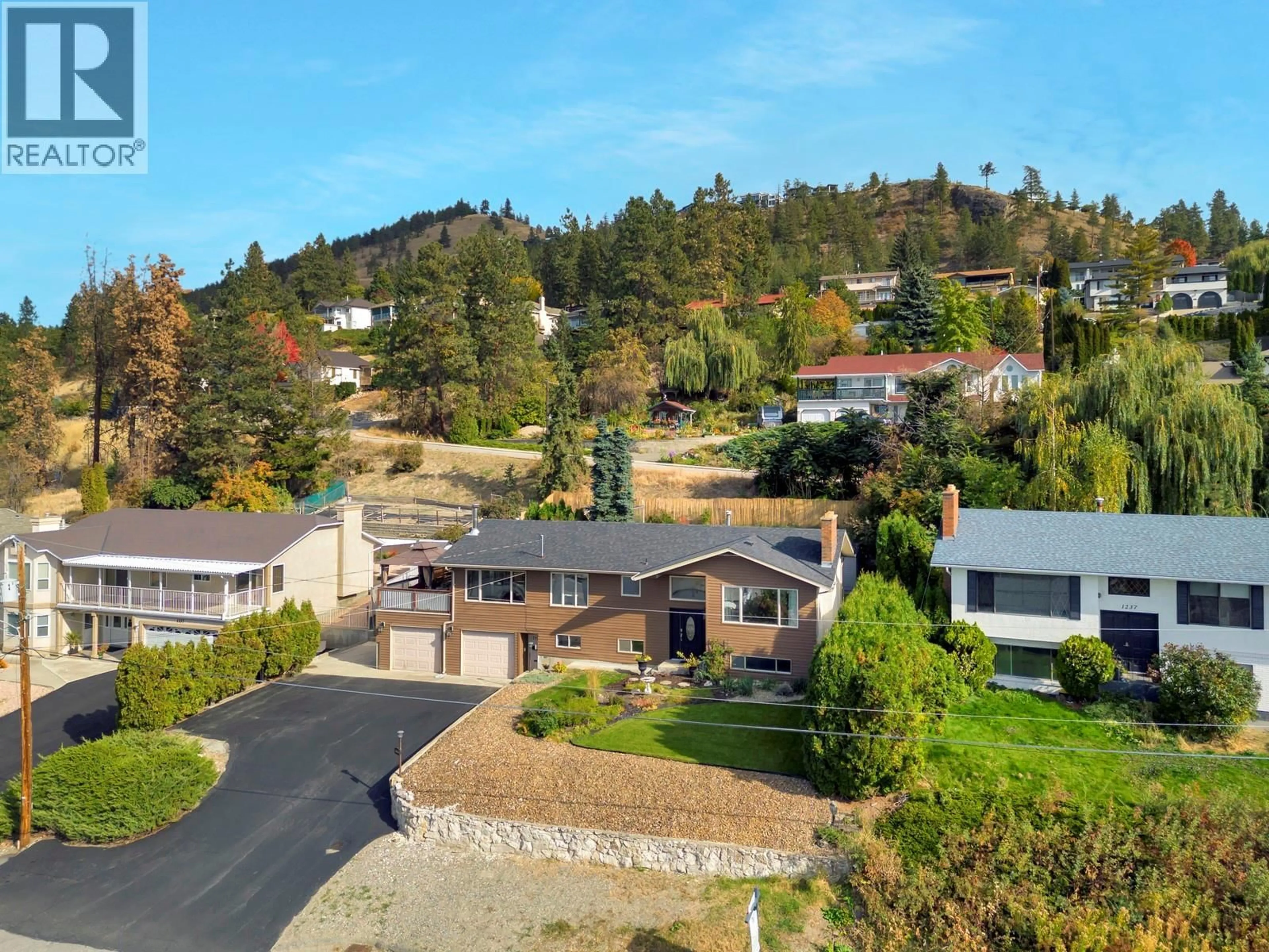 A pic from outside/outdoor area/front of a property/back of a property/a pic from drone, mountain view for 1197 BENTIEN ROAD, Kelowna British Columbia V1X6R9