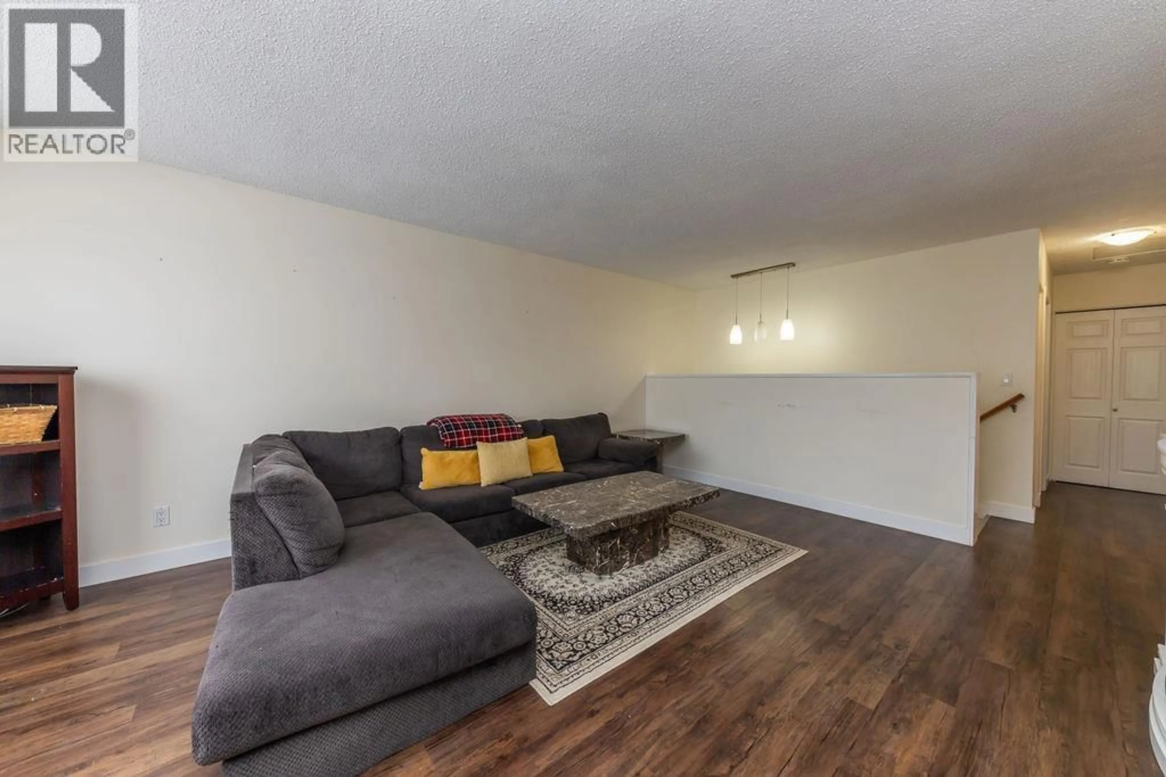 Living room with furniture, wood/laminate floor for 353 WADDINGTON DRIVE, Kamloops British Columbia V2E1S3