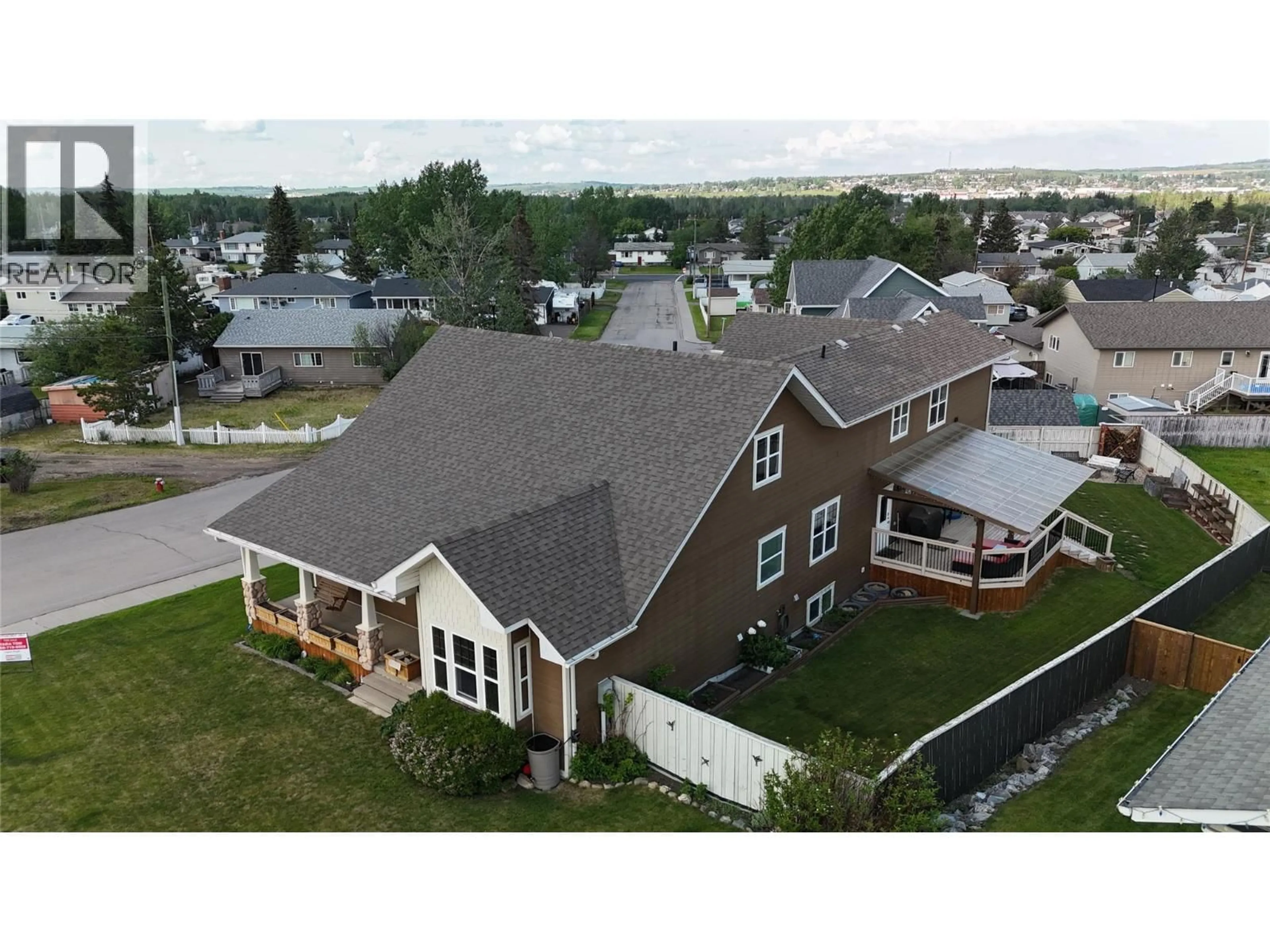 A pic from outside/outdoor area/front of a property/back of a property/a pic from drone, mountain view for 1820 110 AVENUE, Dawson Creek British Columbia V1G0A3