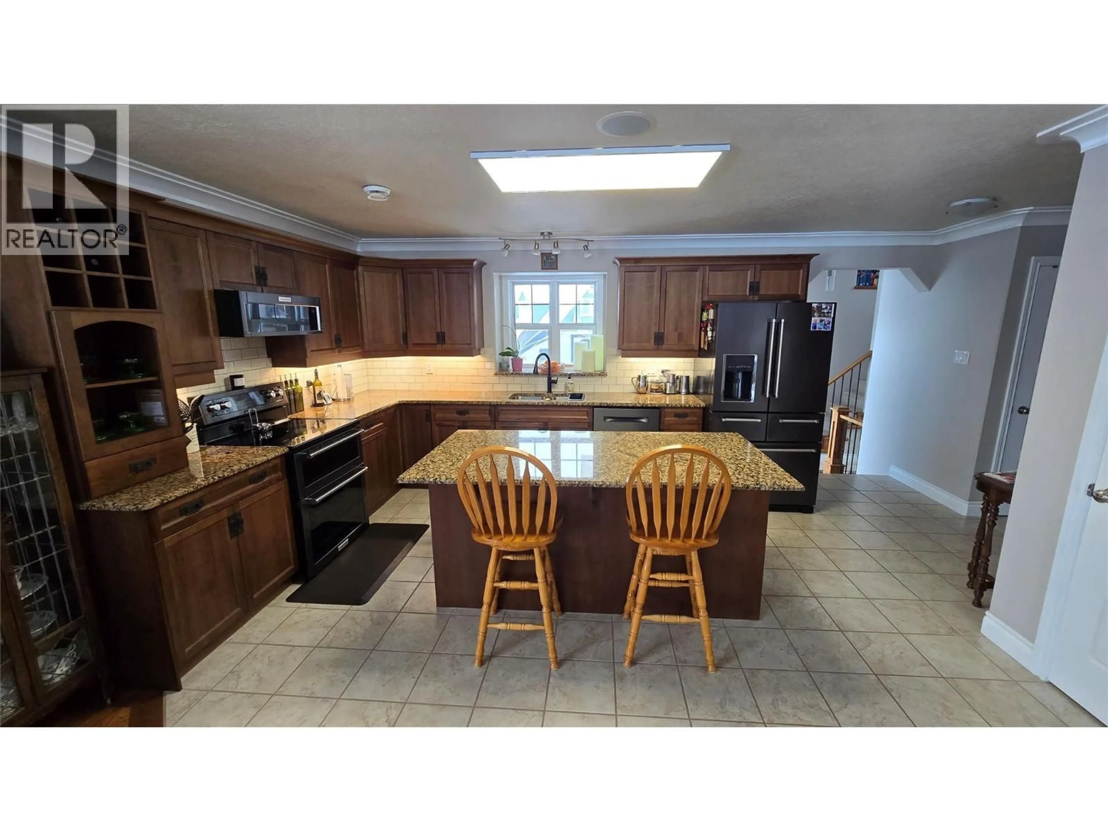 Open concept kitchen, ceramic/tile floor for 1820 110 AVENUE, Dawson Creek British Columbia V1G0A3