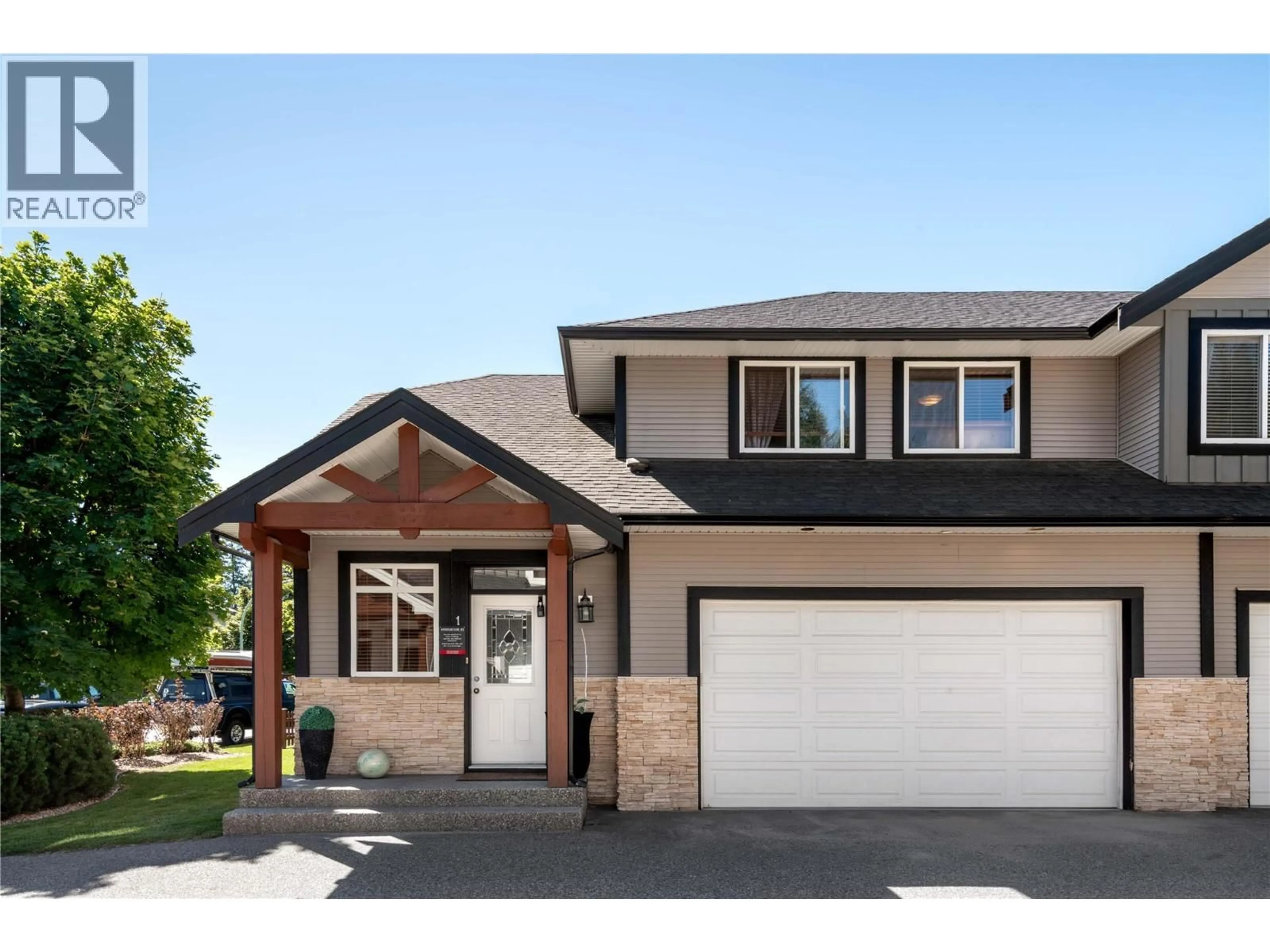 Home with vinyl exterior material, street for 1 - 1450 ROSE MEADOW DRIVE, West Kelowna British Columbia V1Z4A4