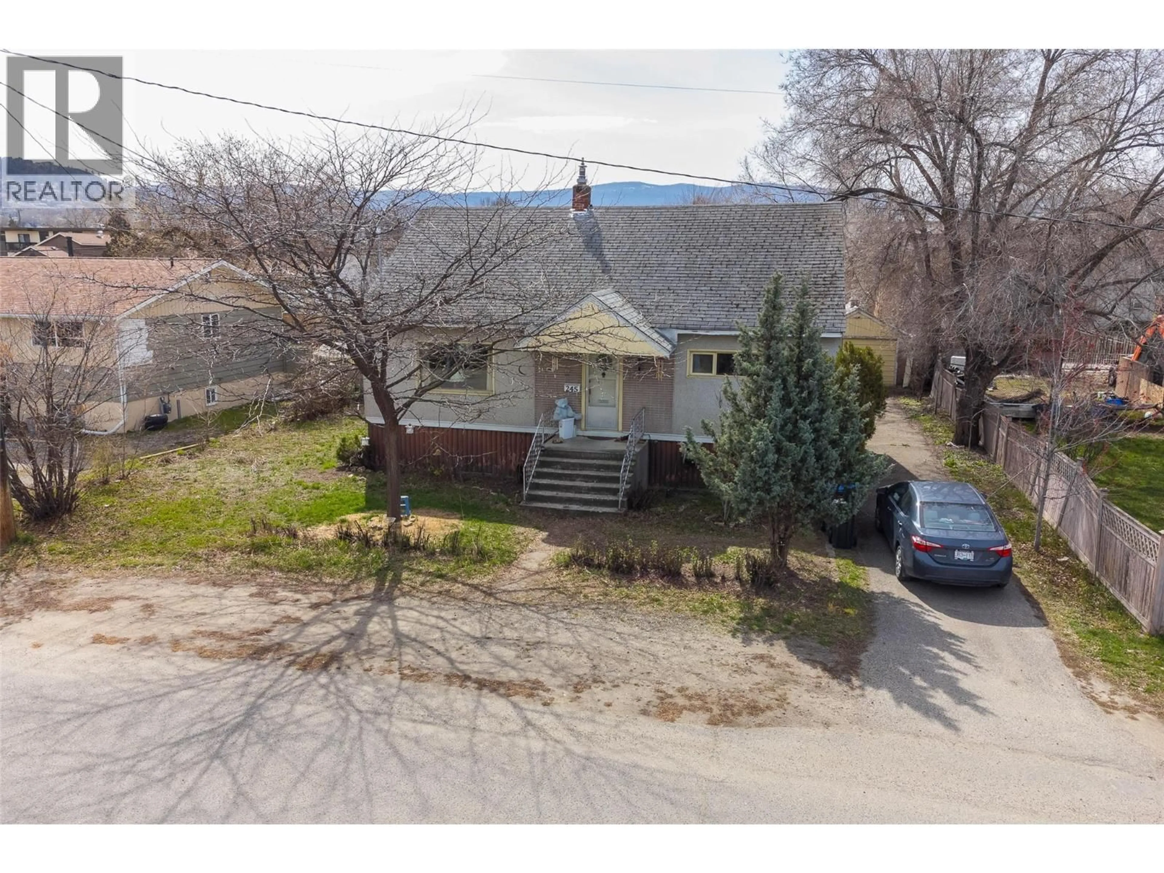 A pic from outside/outdoor area/front of a property/back of a property/a pic from drone, street for 245 PONTO ROAD, Kelowna British Columbia V1X2G2