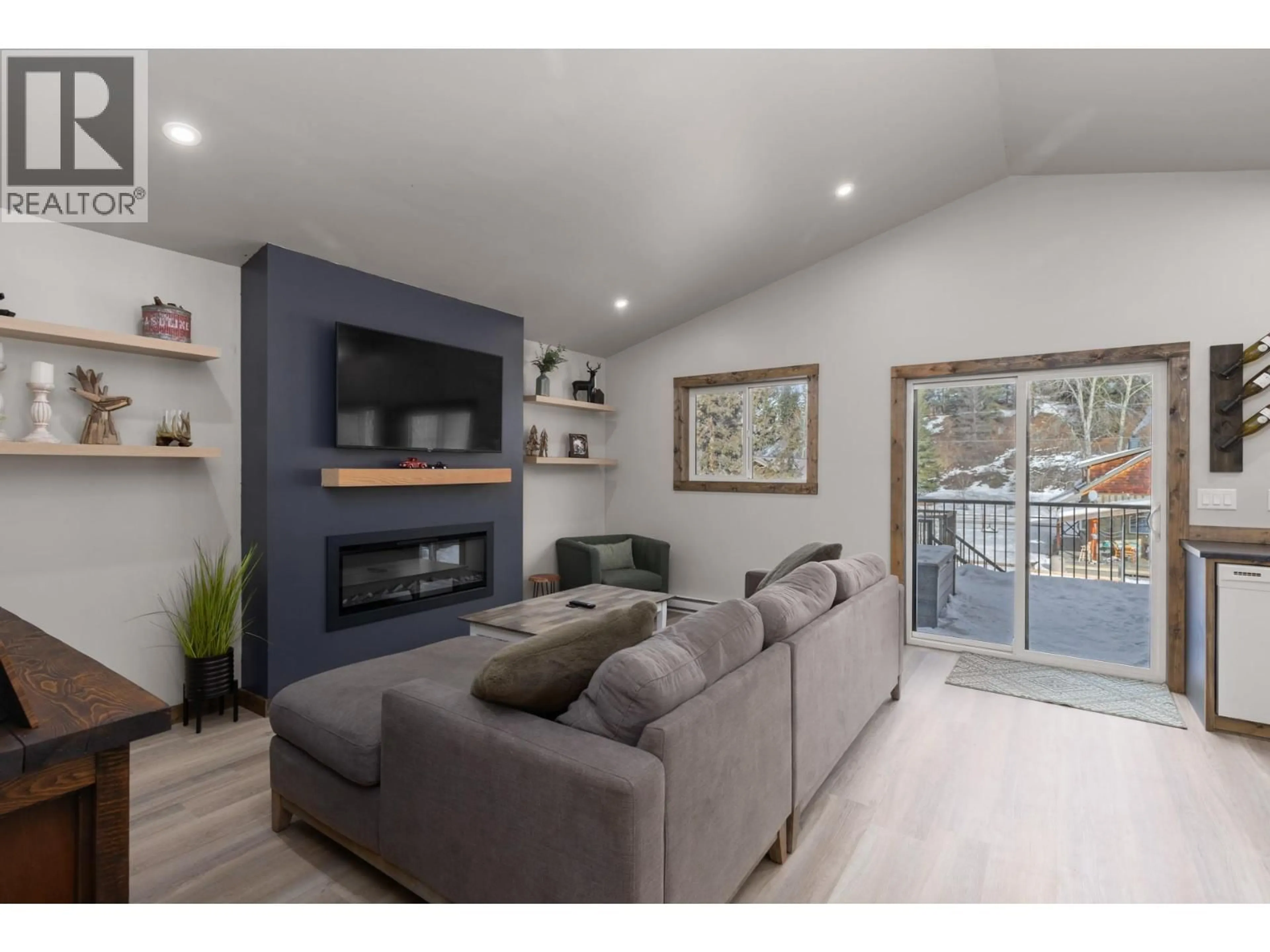 Living room with furniture, wood/laminate floor for 1890 MAIN STREET, Coalmont-Tulameen British Columbia V0X1W0