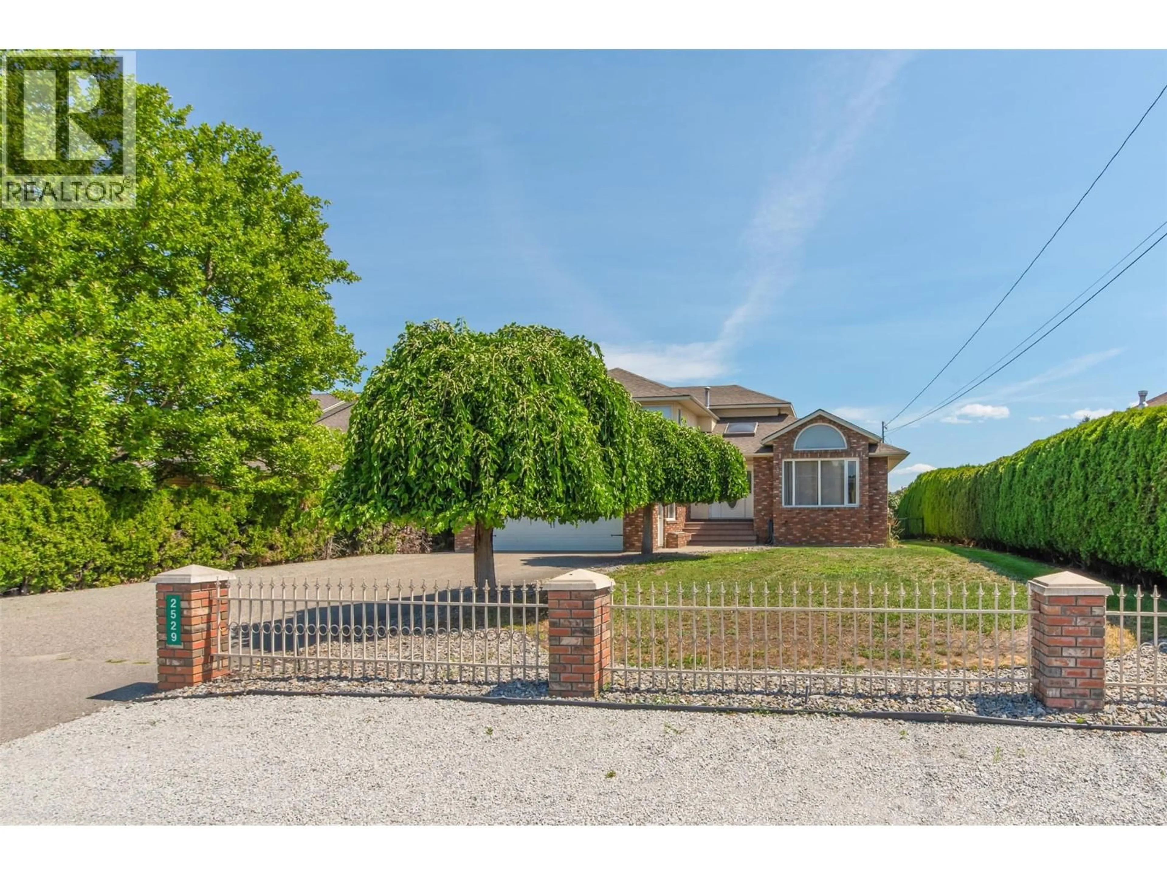 A pic from outside/outdoor area/front of a property/back of a property/a pic from drone, street for 2529 THACKER DRIVE, West Kelowna British Columbia V1Z1W2