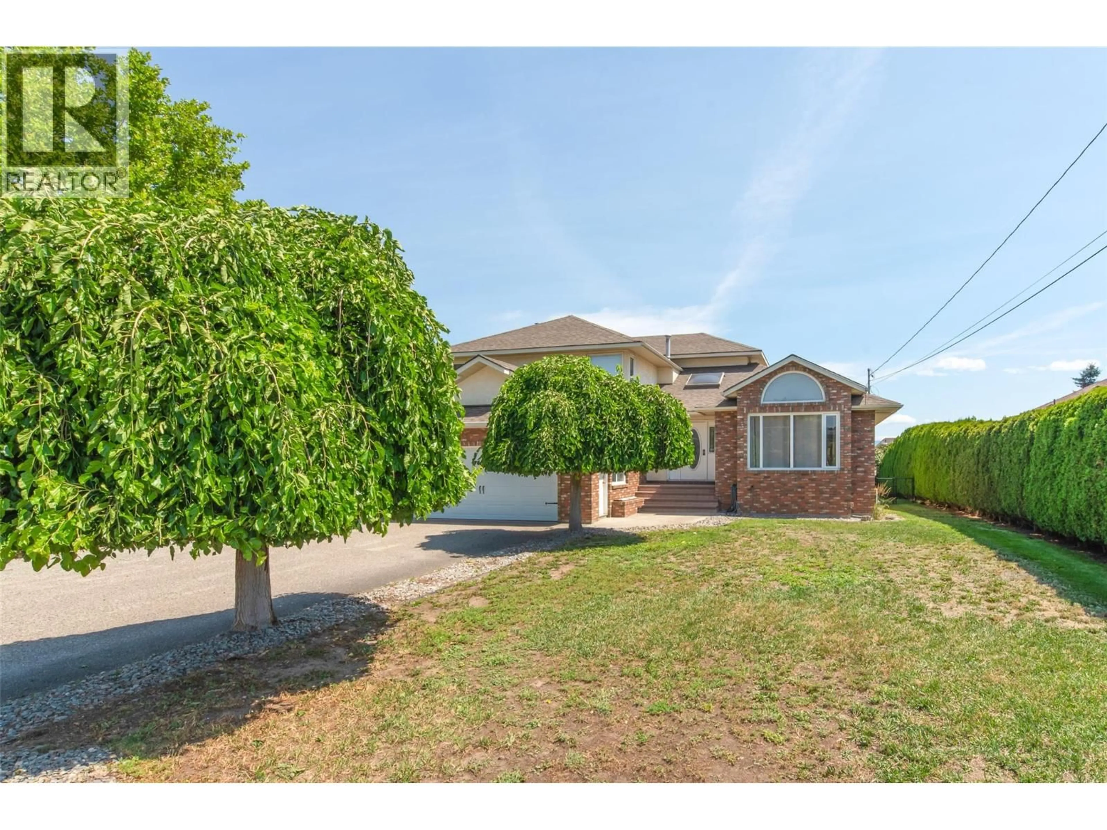 A pic from outside/outdoor area/front of a property/back of a property/a pic from drone, street for 2529 THACKER DRIVE, West Kelowna British Columbia V1Z1W2