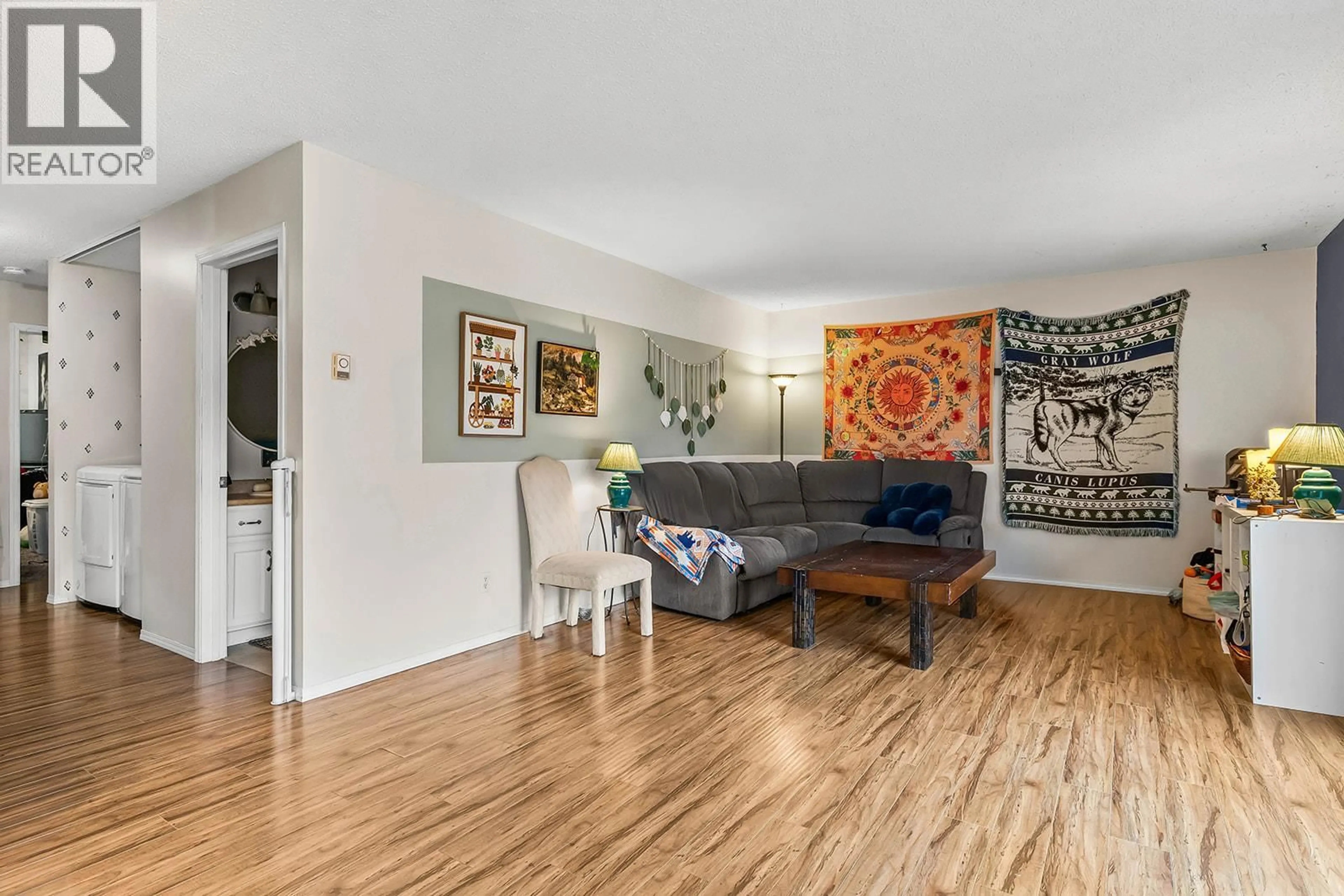 Living room with furniture, wood/laminate floor for 103A - 880 BADKE ROAD, Kelowna British Columbia V1X5Z6
