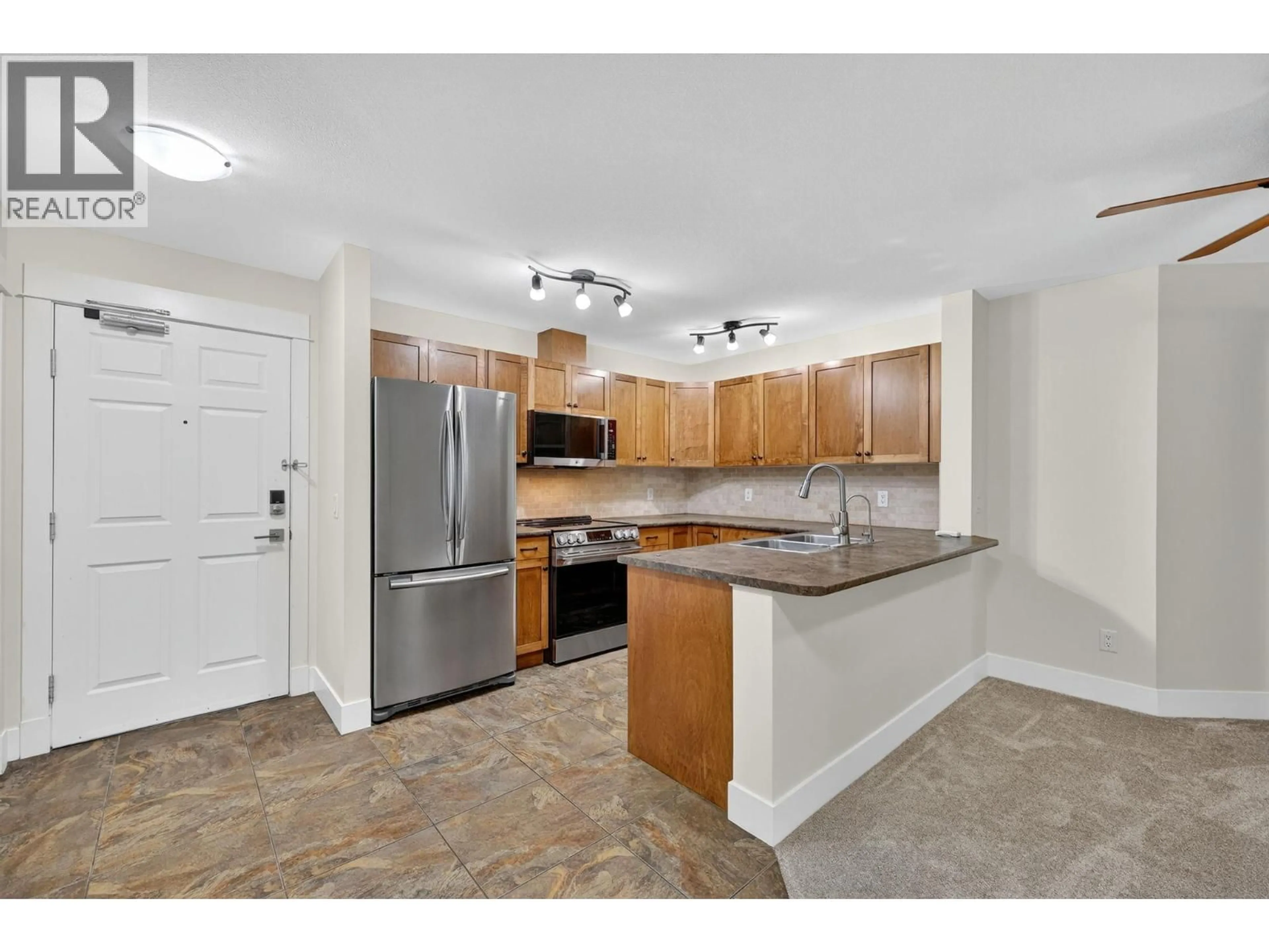 Standard kitchen, ceramic/tile floor for 409 - 135 ZIPRICK ROAD, Kelowna British Columbia V1X8B2