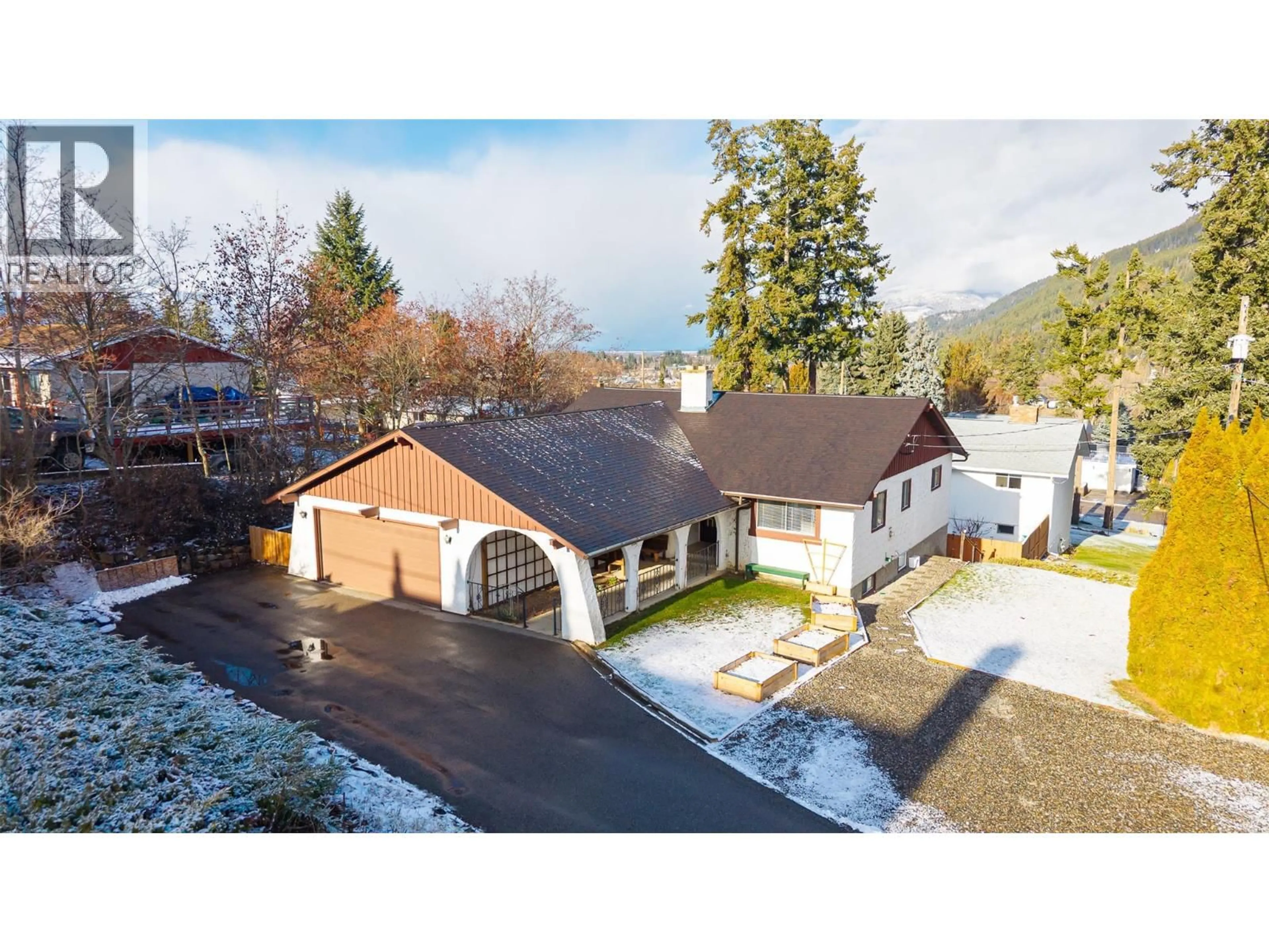 A pic from outside/outdoor area/front of a property/back of a property/a pic from drone, mountain view for 703 11TH AVENUE NORTH, Creston British Columbia V0B1G4